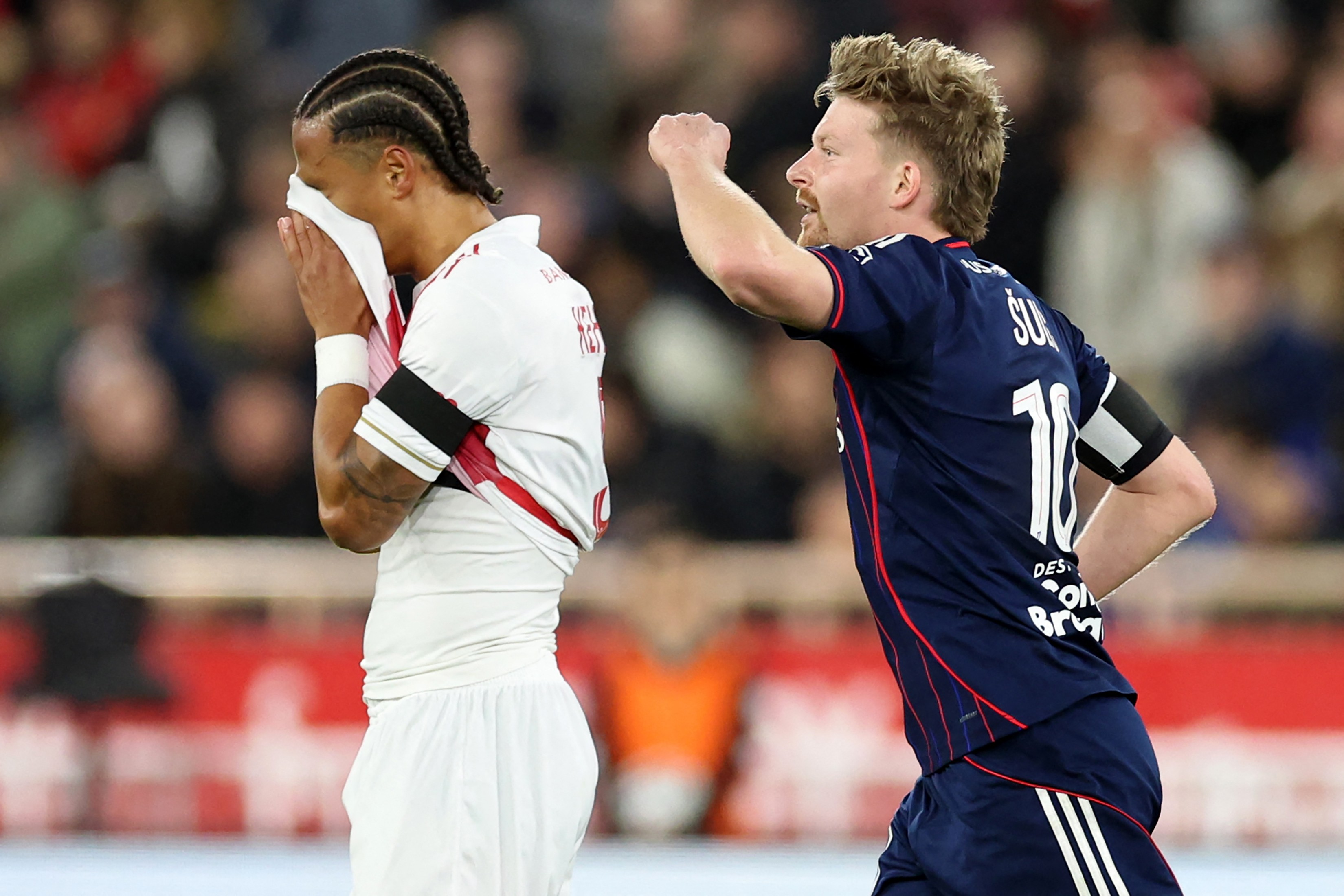Sulc (right) celebrates scoring for Lyon