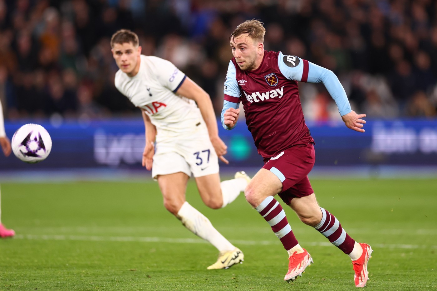 Tottenham's Micky van de Ven chases West Ham's Jarrod Bowen