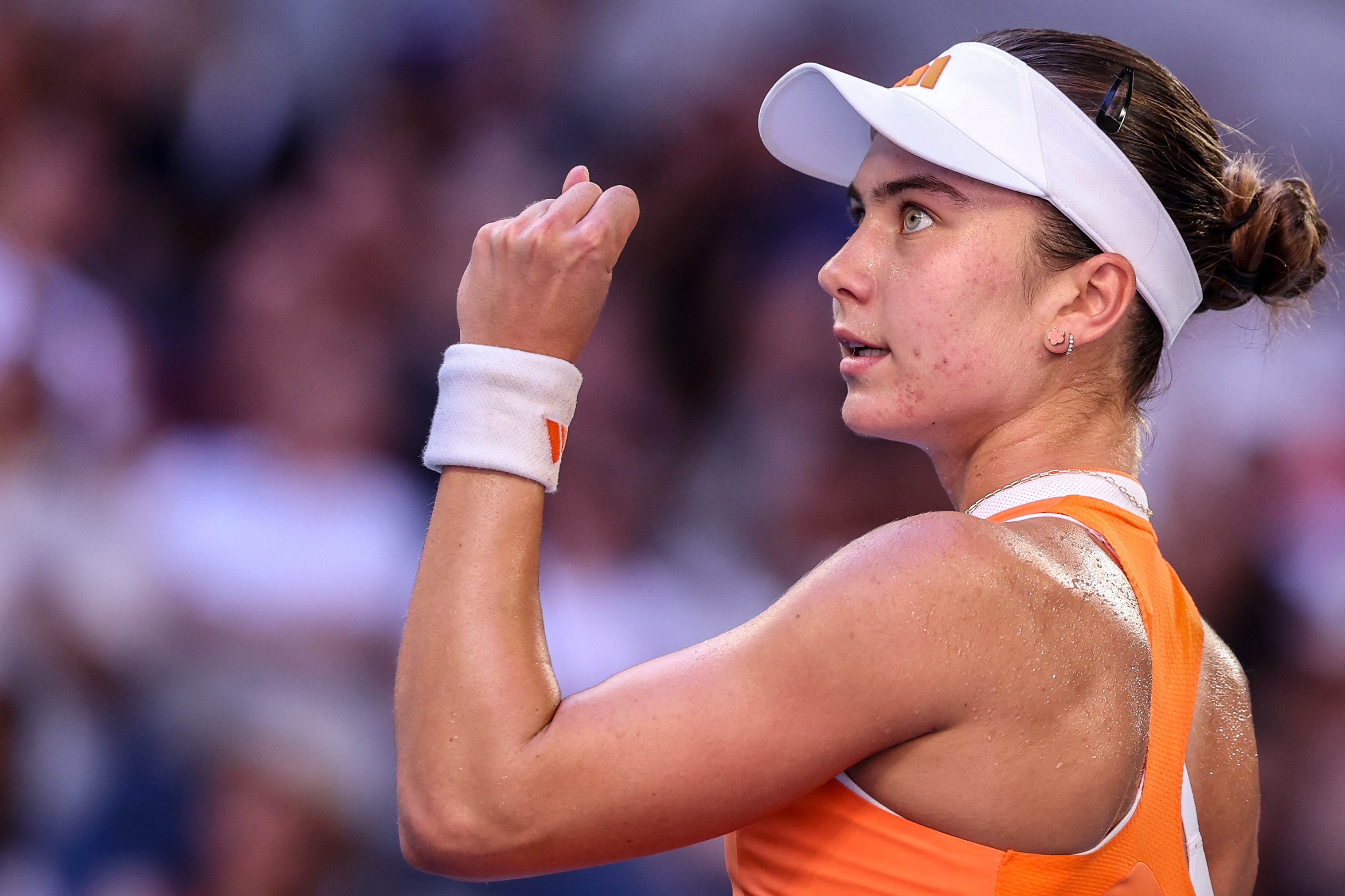 Iva Jovic reacts after a point against Jasmine Paolini