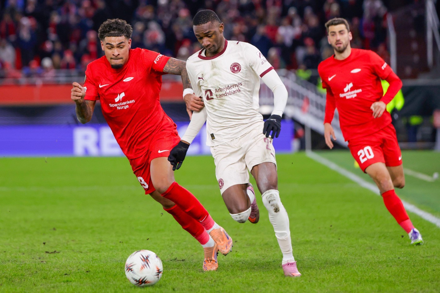 Brann's Noah Holm and FC Midtjylland's Denil Castillo battle for the ball in Bergen