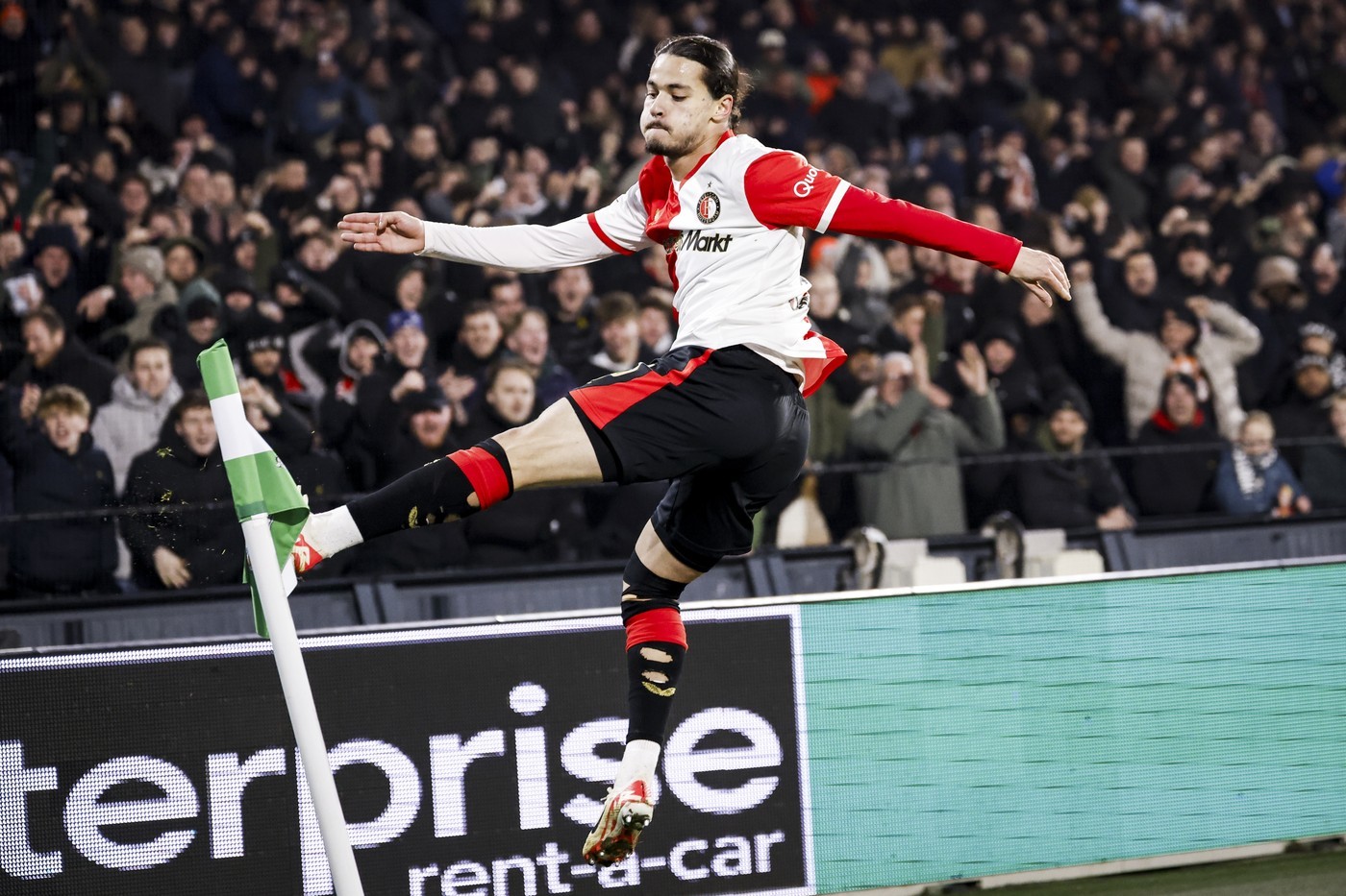 Feyenoord's Anis Hadj Moussa kicks the corner flag after scoring the 2-0 against Sturm Graz