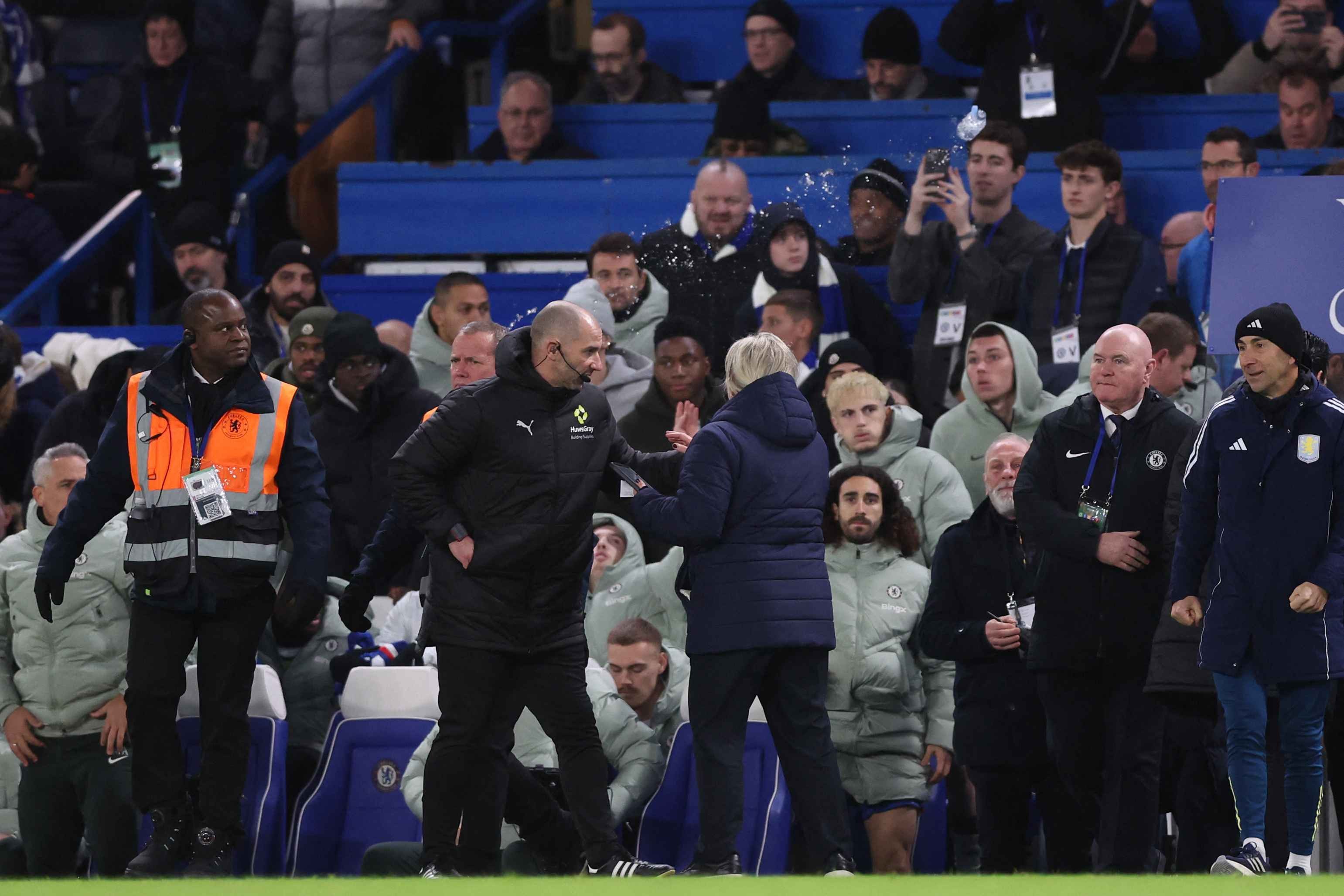 A bottle of water is thrown in the direction of the Aston Villa bench at Stamford Bridge