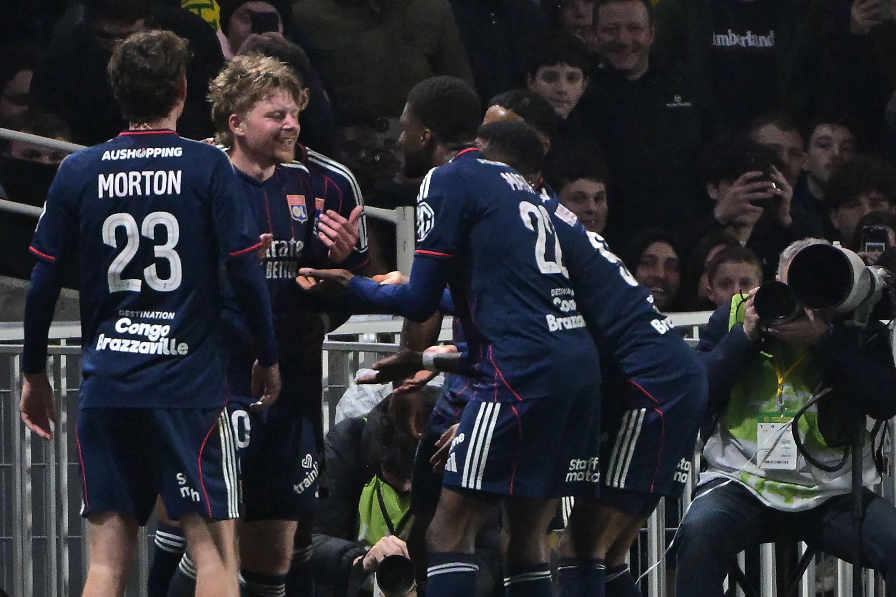 Lyon's players celebrate their goal