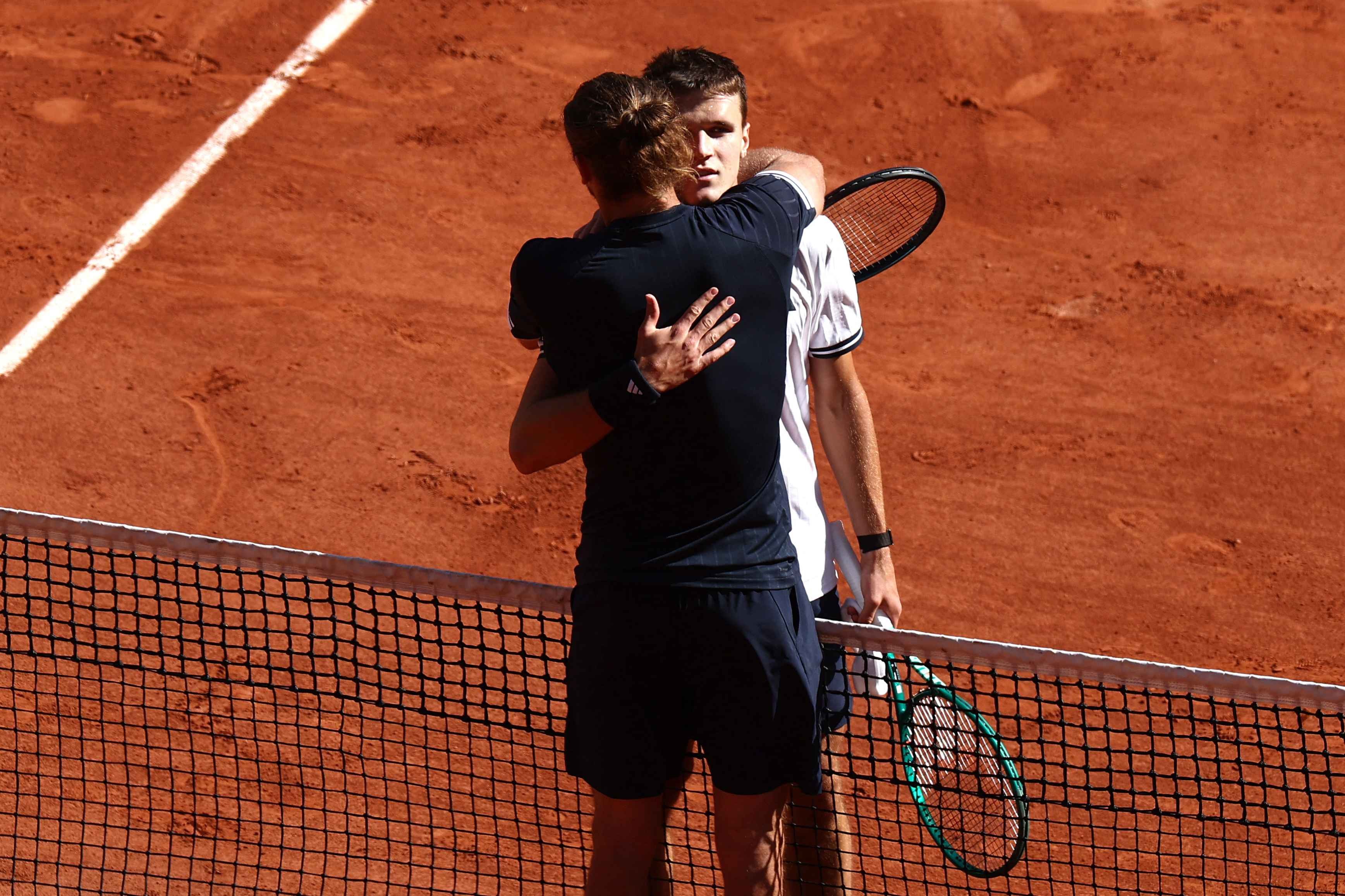Jakub Mensik and Alexander Zverev embrace after the match