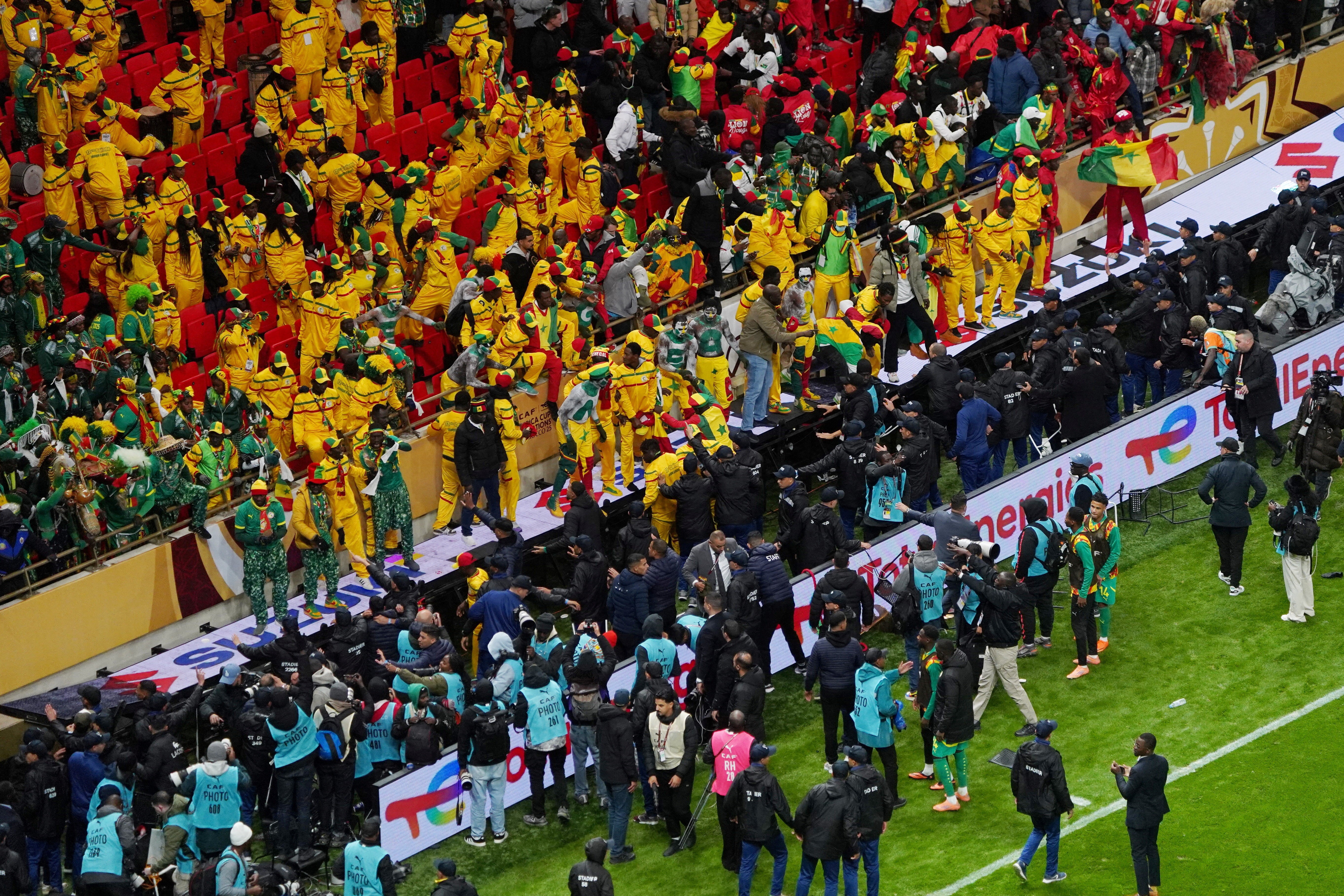 Senegal fans react in the stand after Morocco were awarded a penalty following a VAR review during the AFCON final
