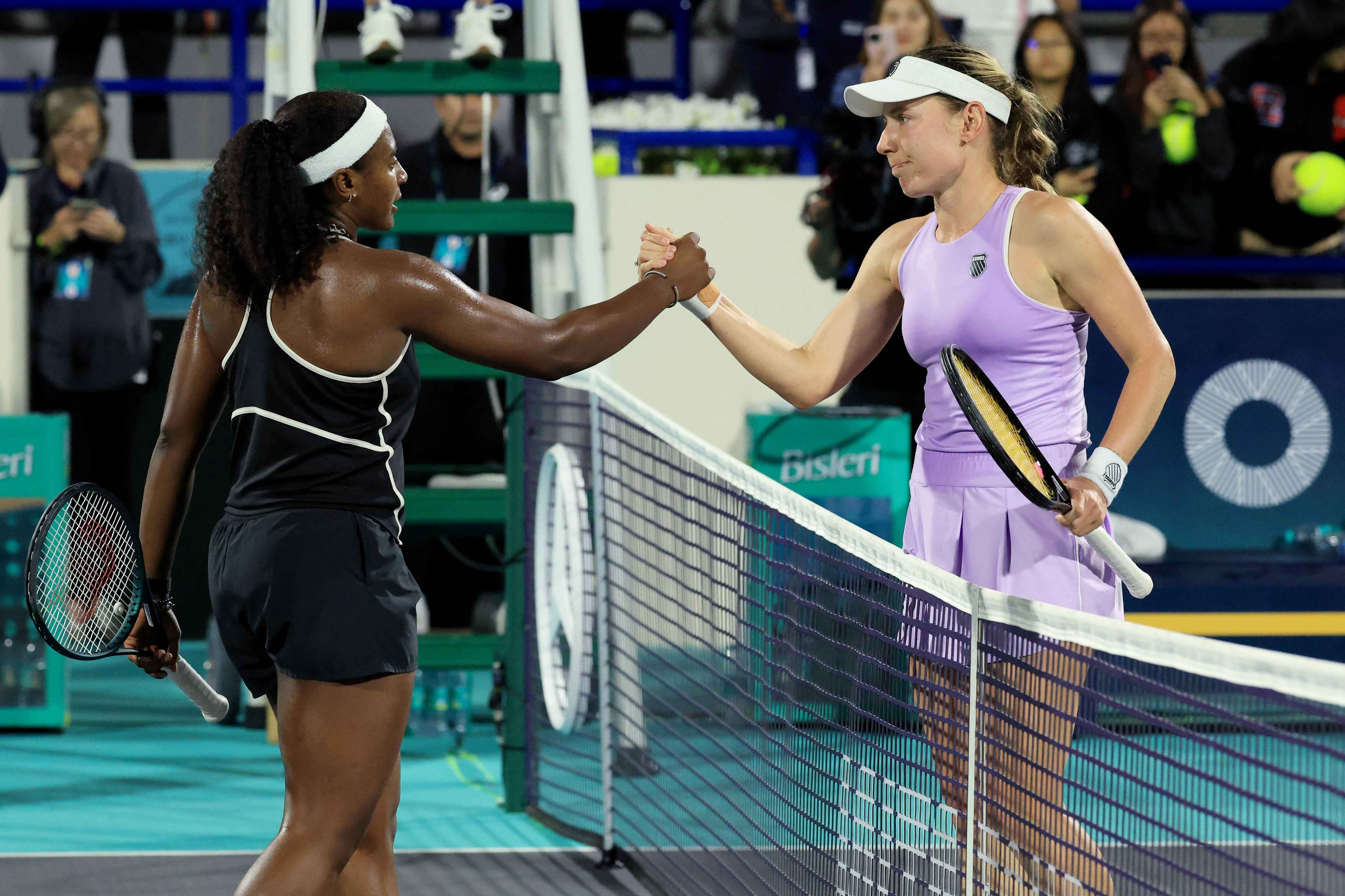 Ekaterina Alexandrova shakes hands with Hailey Baptiste after her win
