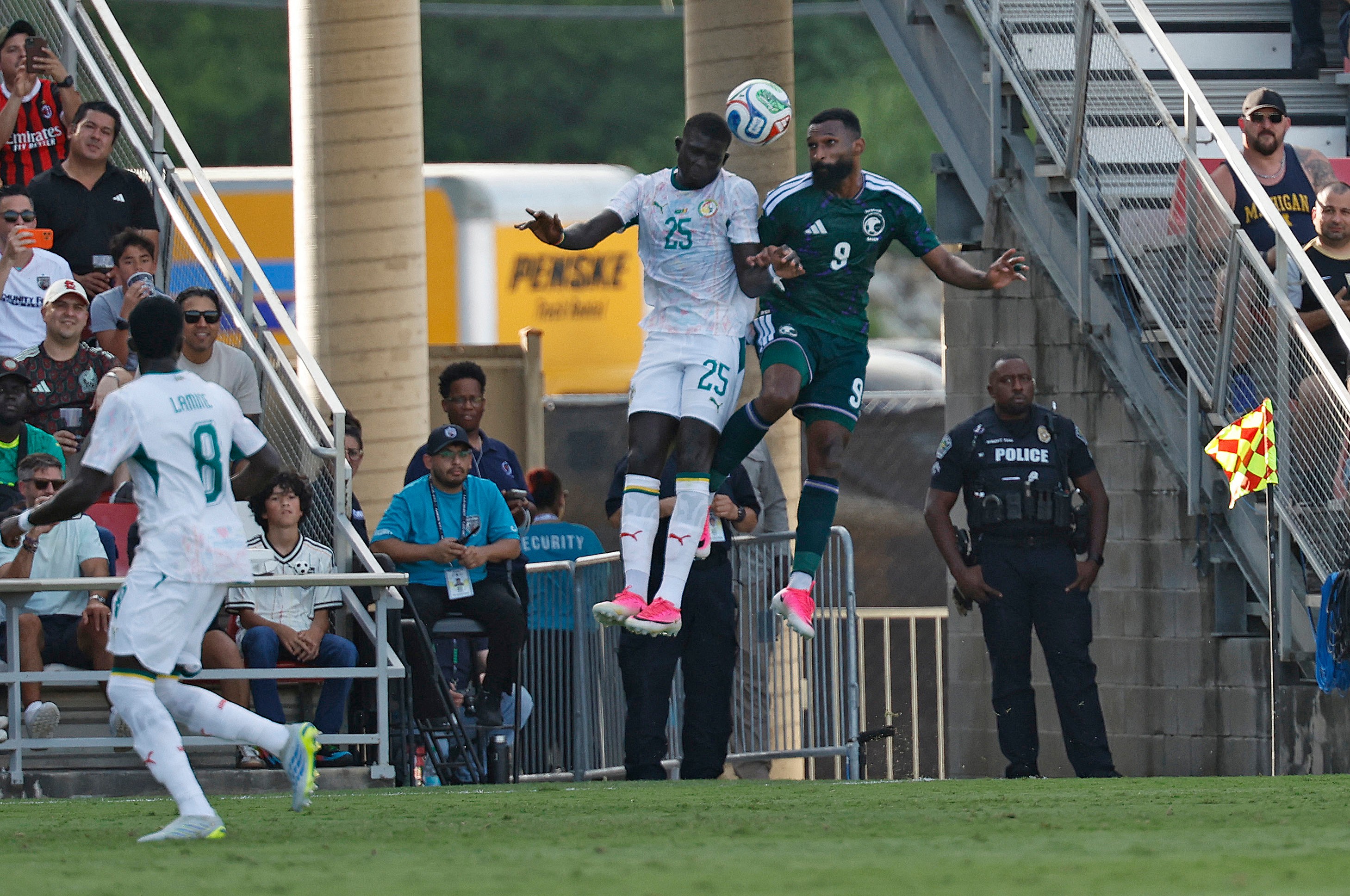 El Hadji Malick Diouf (left) and Feras Al-Brikan (right) battle for the ball in Saudia Arabia-Senegal friendly