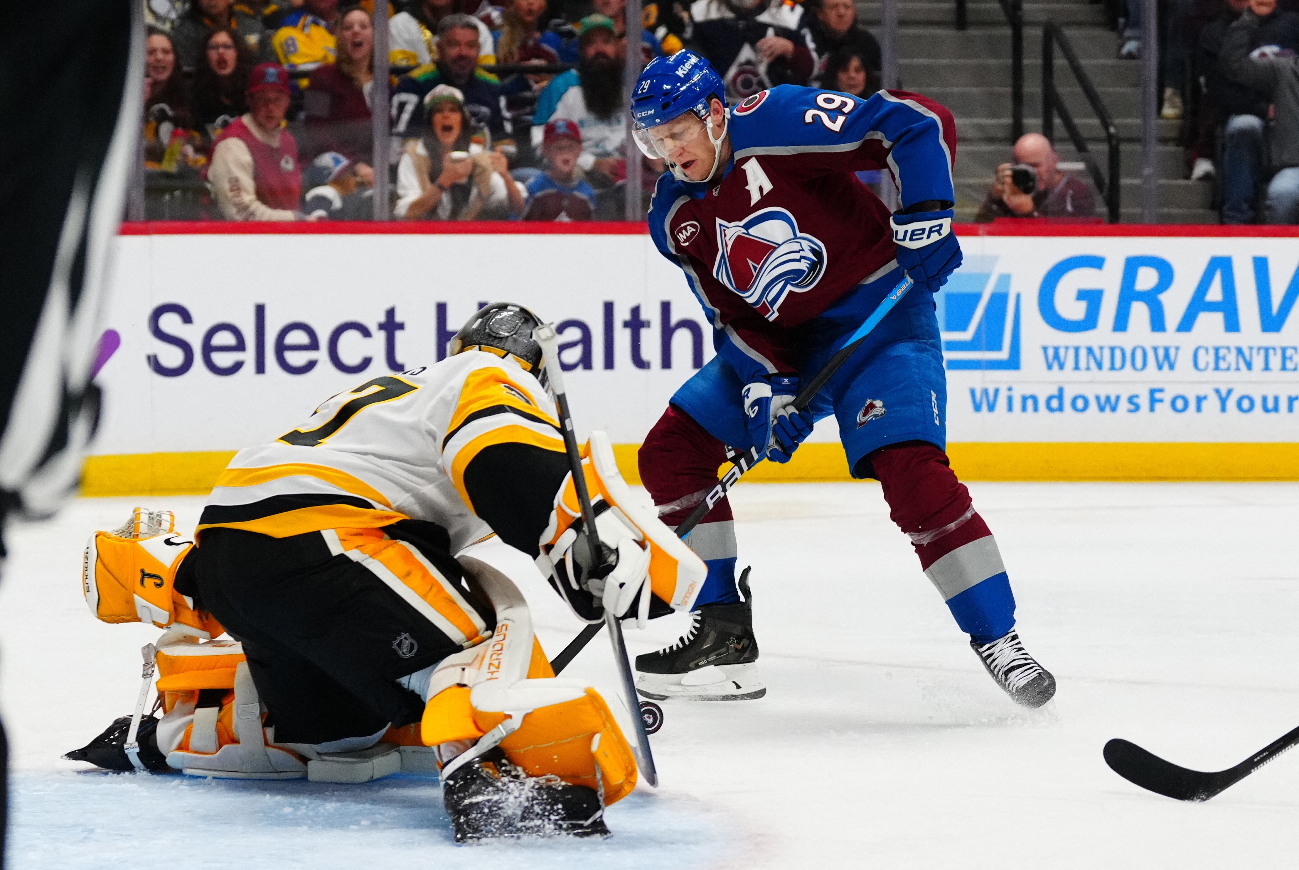 Nathan MacKinnon scores against the Pittsburgh Penguins