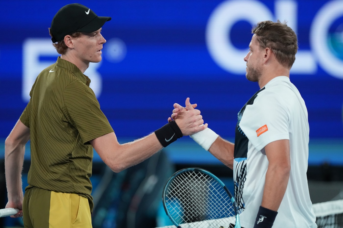 Jannik Sinner and James Duckworth at the end of the match