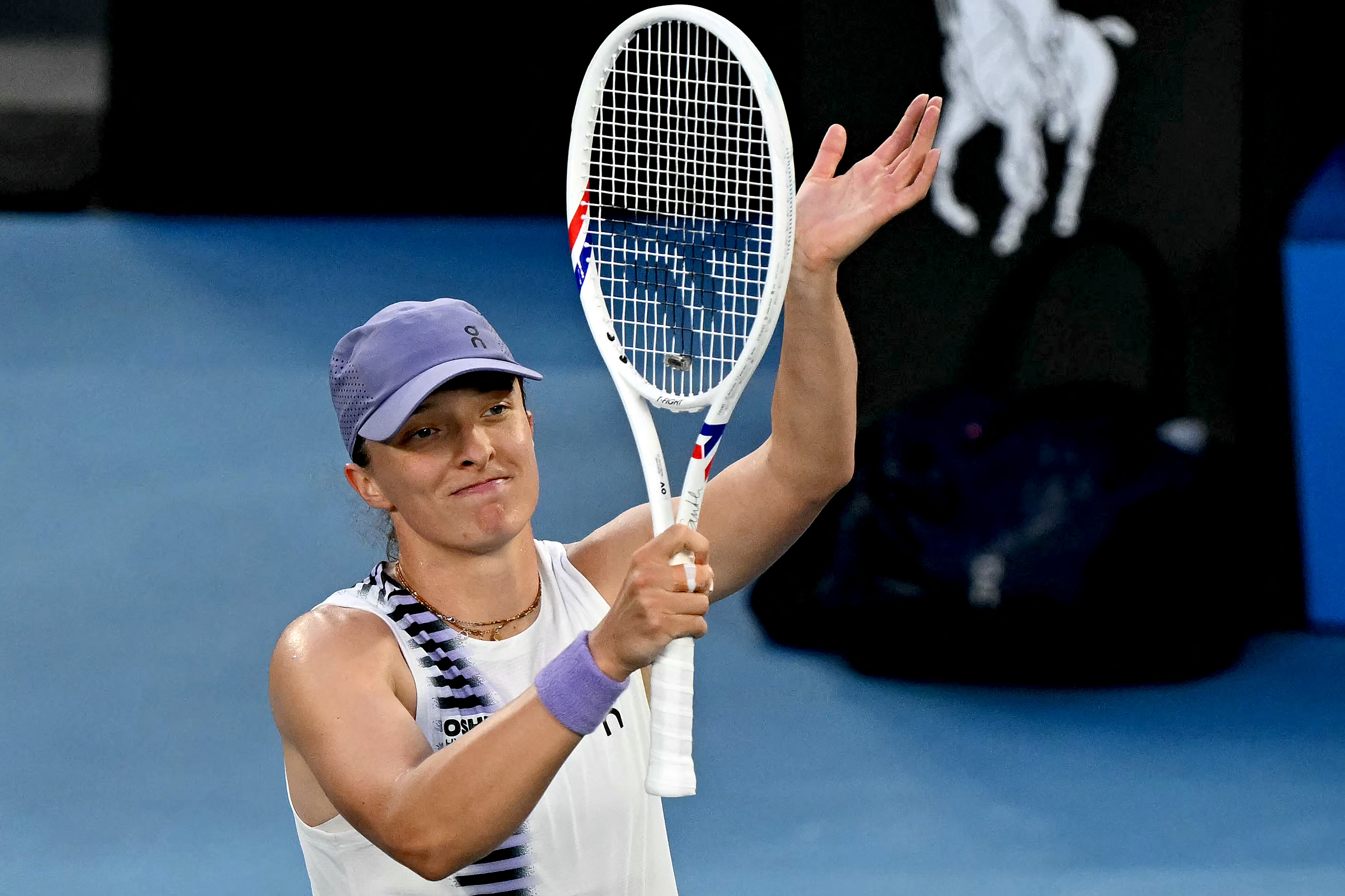 Iga Swiatek celebrates victory over Maddison Inglis