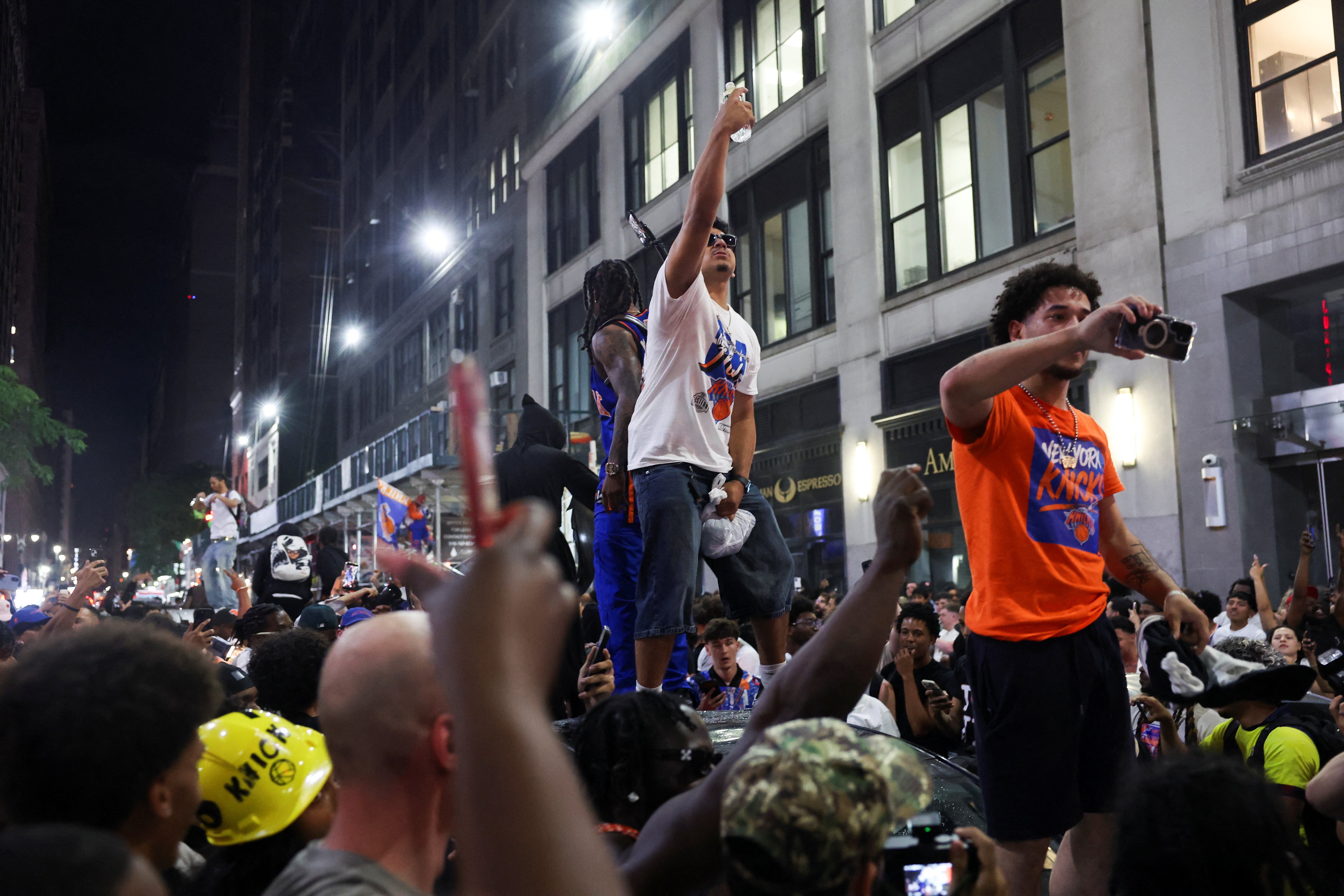Fans celebrate after the New York Knicks beat the San Antonio Spurs in the Game 4 of the NBA Finals