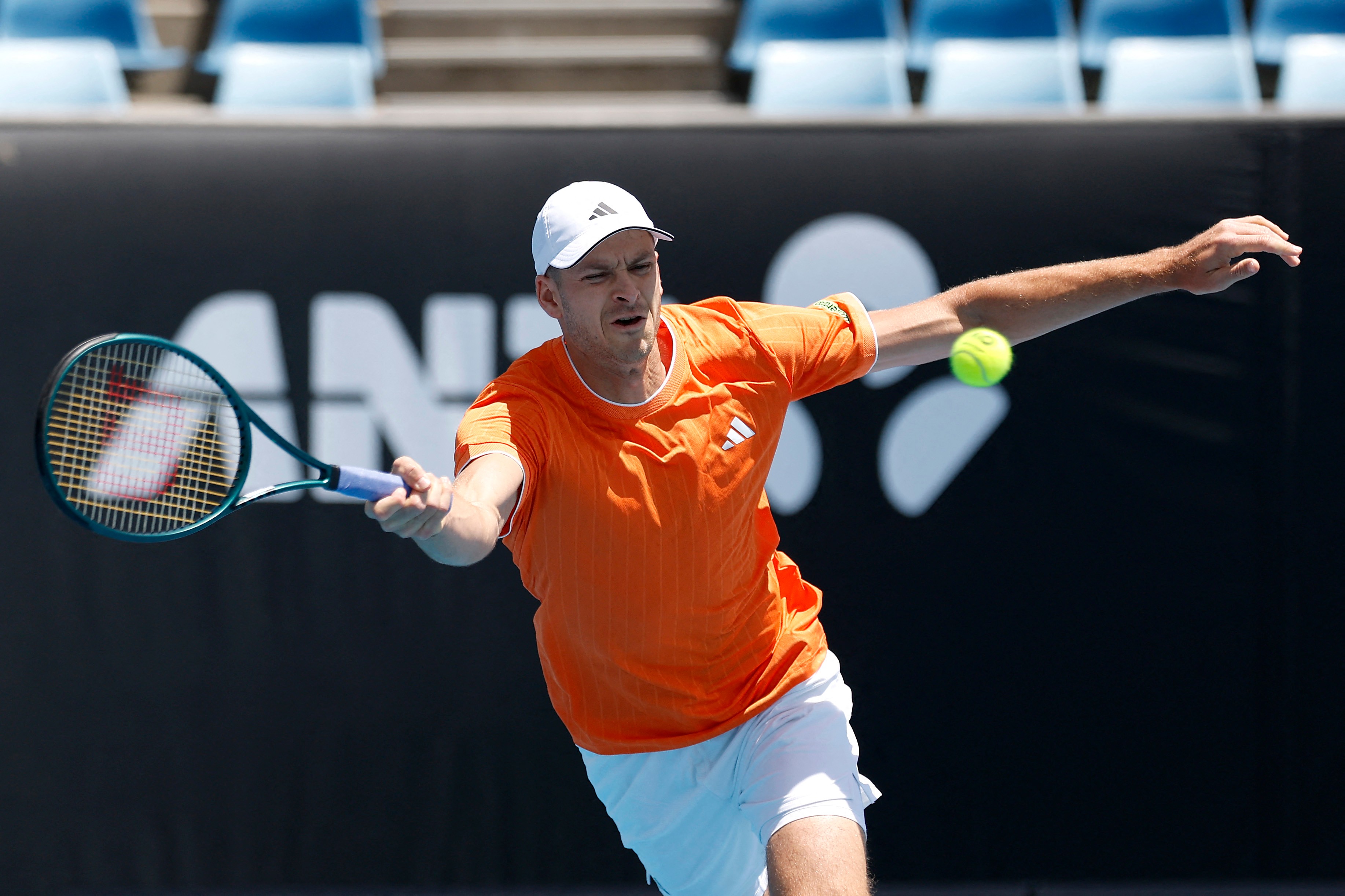 Hubert Hurkacz returns a serve during his second round Australian Open defeat. 