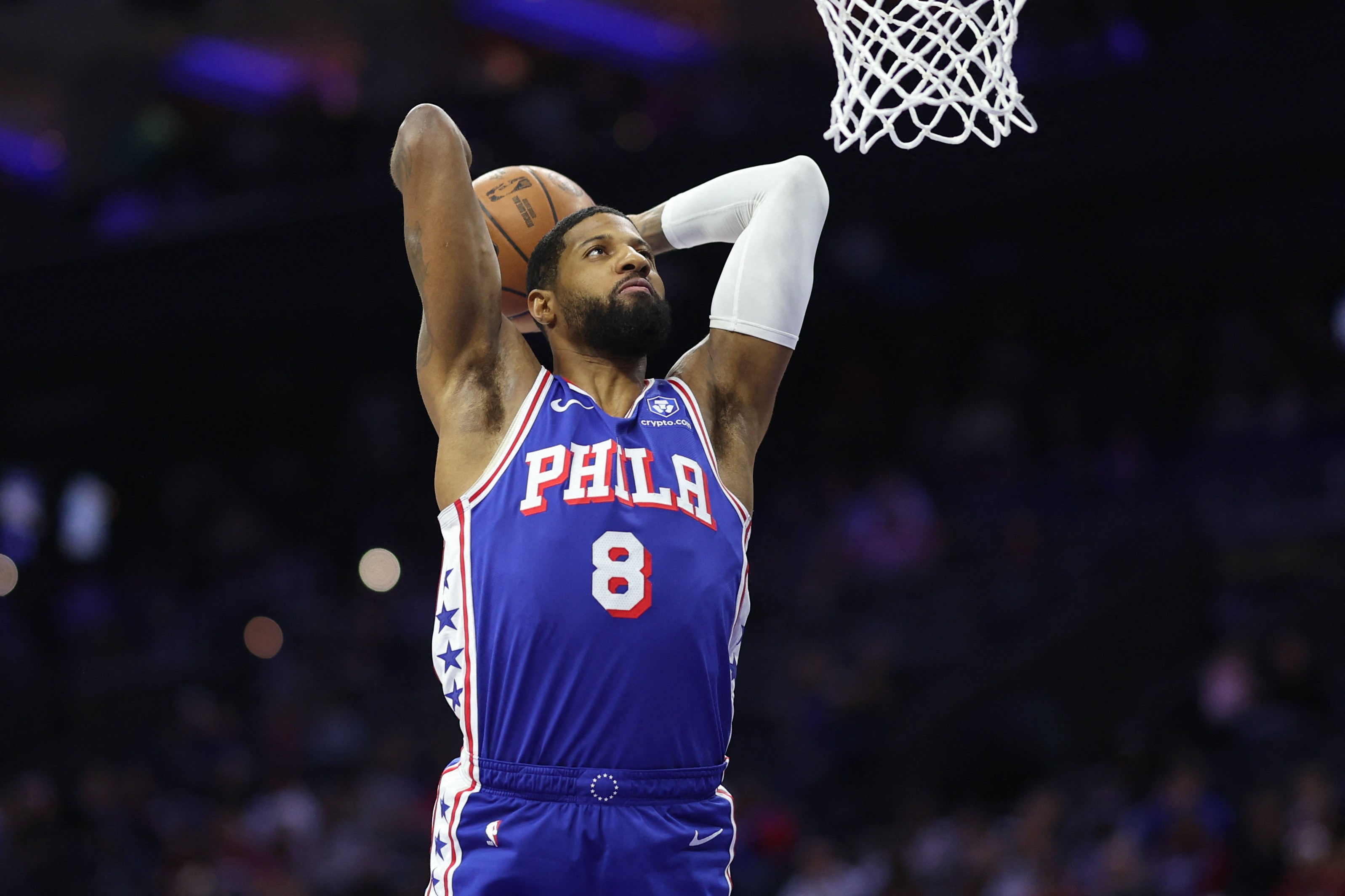 Philadelphia 76ers forward Paul George dunks the ball against the Houston Rockets