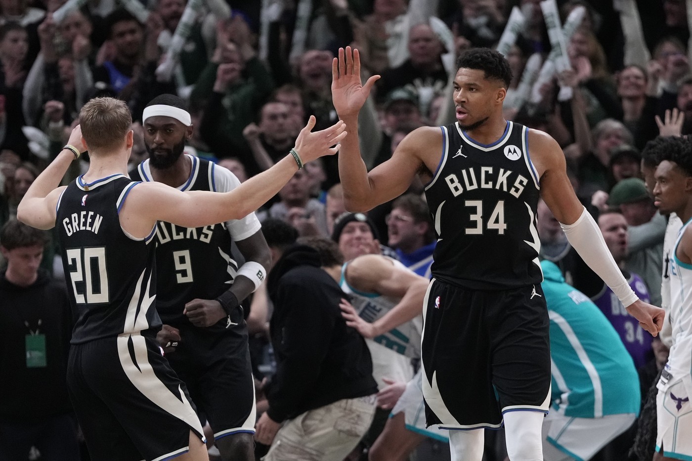 Milwaukee Bucks' Giannis Antetokounmpo celebrates with AJ Green