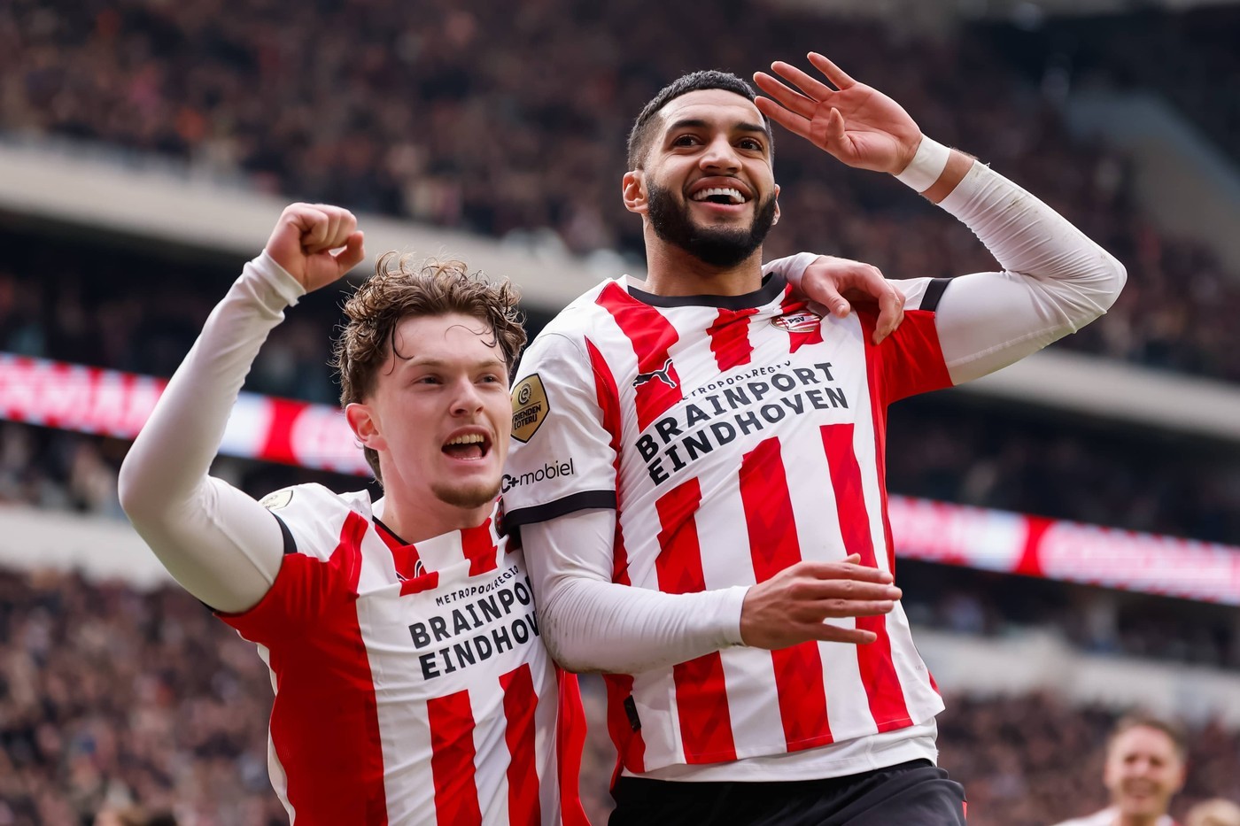 PSV's Ismael Saibari (R) celebrates scoring the 3-0 against Feyenoord with Paul Wanner
