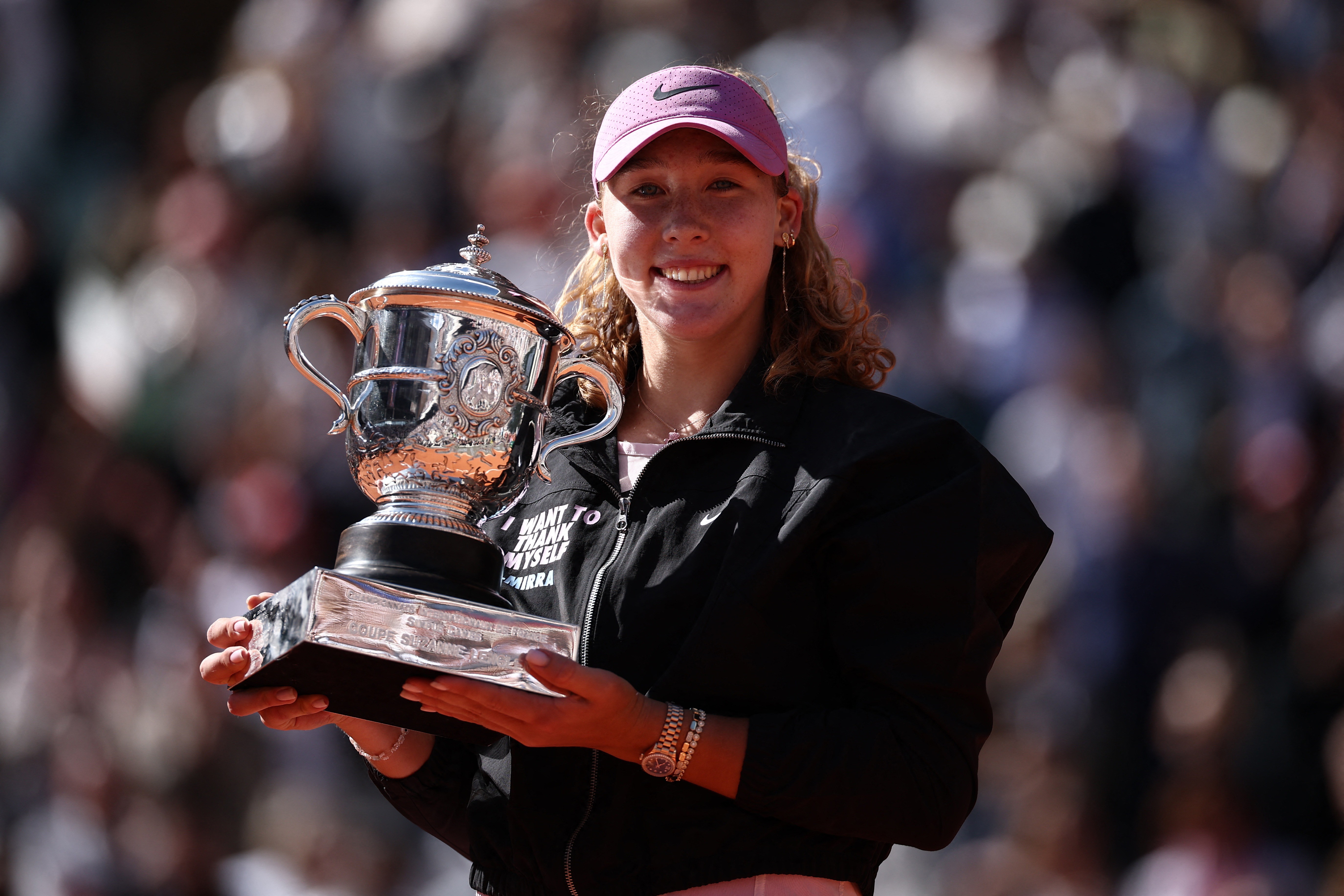 Andreeva celebrates with the French Open trophy