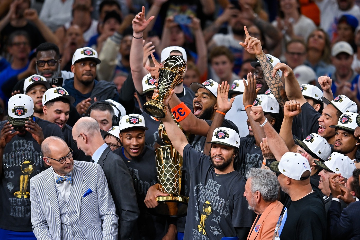 Jalen Brunson (center) lifts NBA MVP trophy after leading Knicks to NBA title