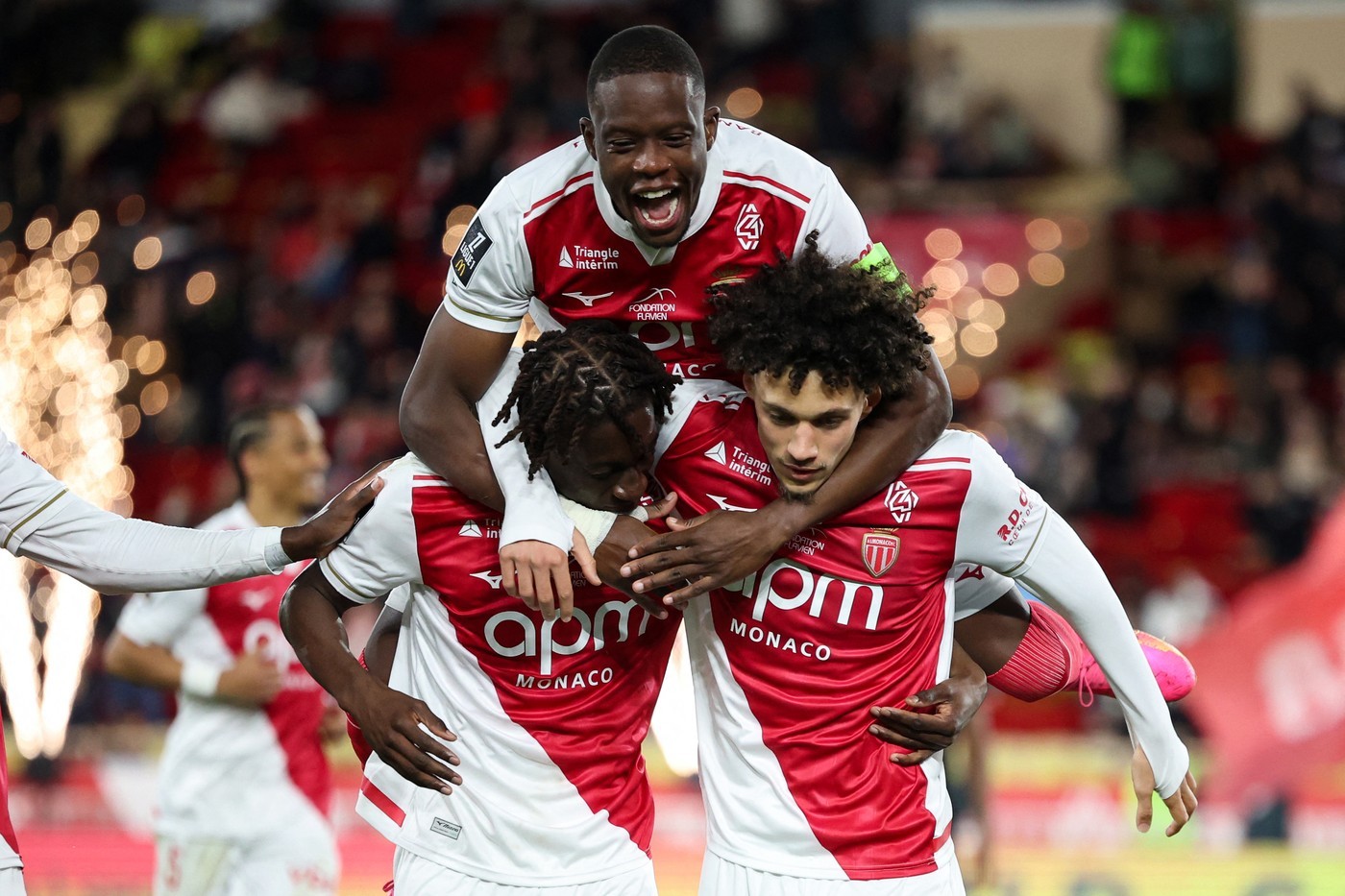 Monaco's French midfielder Maghnes Akliouche celebrates with teammates after scoring his team's second goal