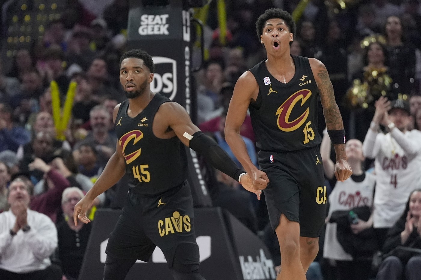 Meleek Thomas (R) celebrates alongside Donovan Mitchell