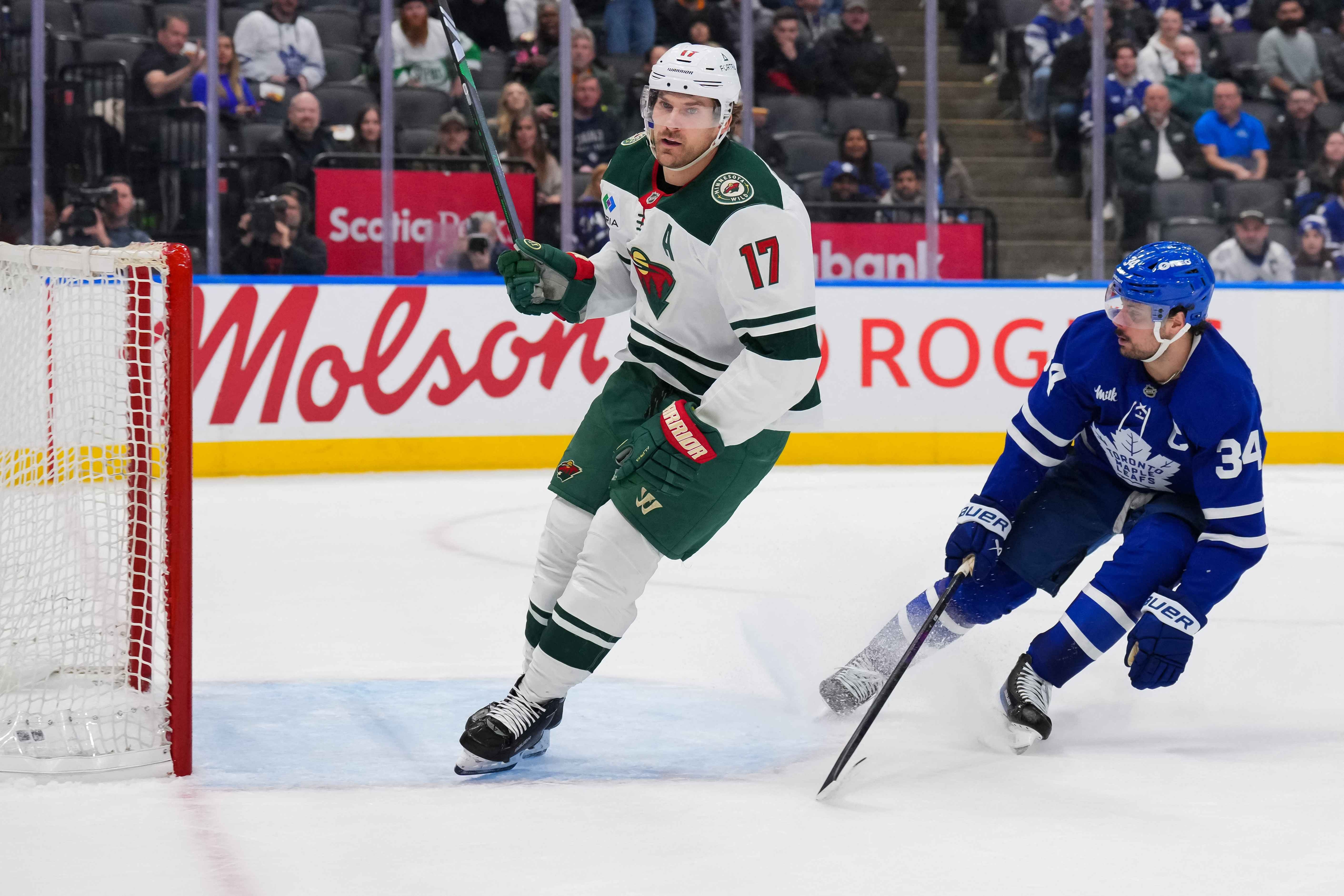 Minnesota's Marcus Foligno scores against the Maple Leafs