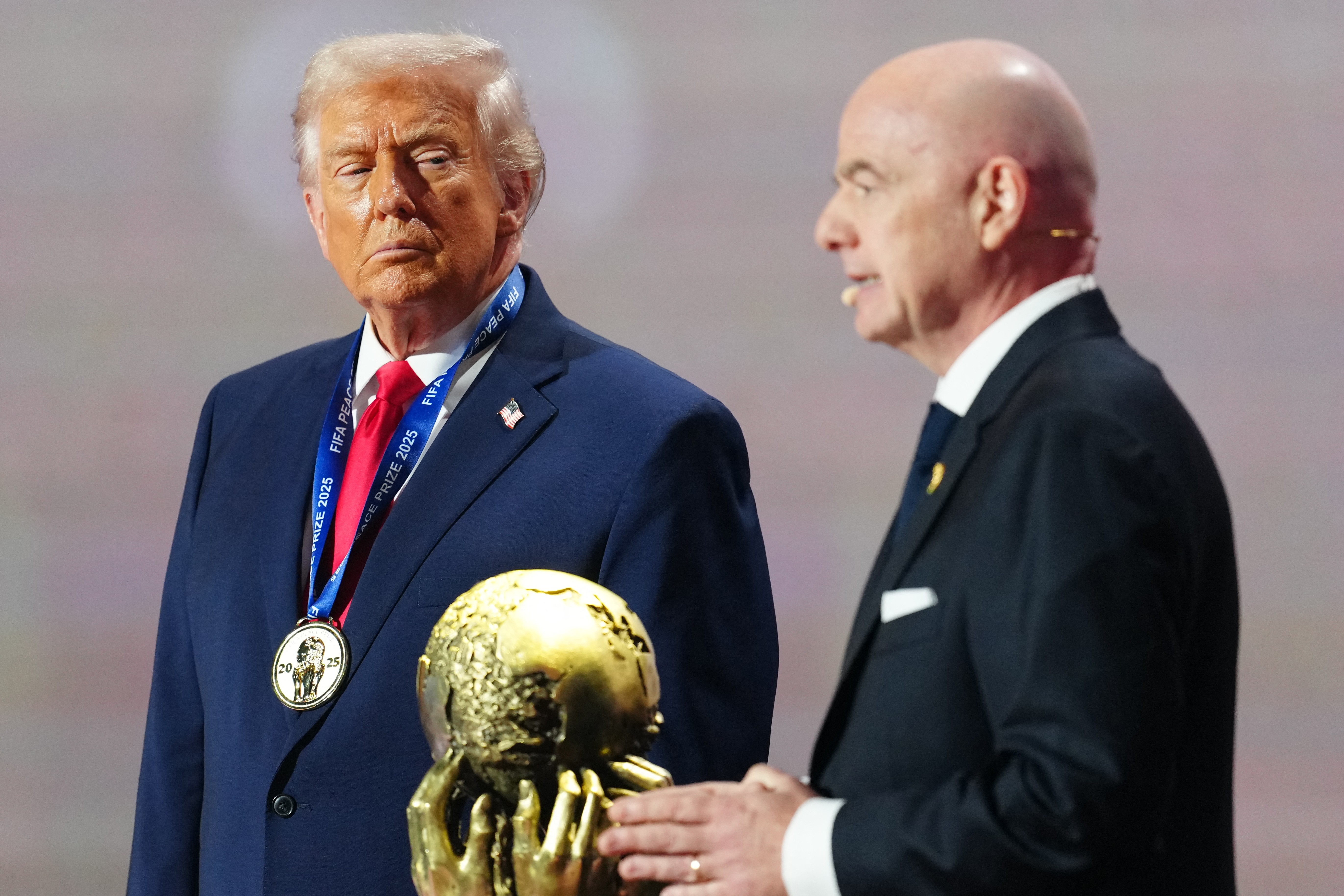 U.S. President Donald Trump gets awarded the FIFA Peace Prize from FIFA president Gianni Infantino