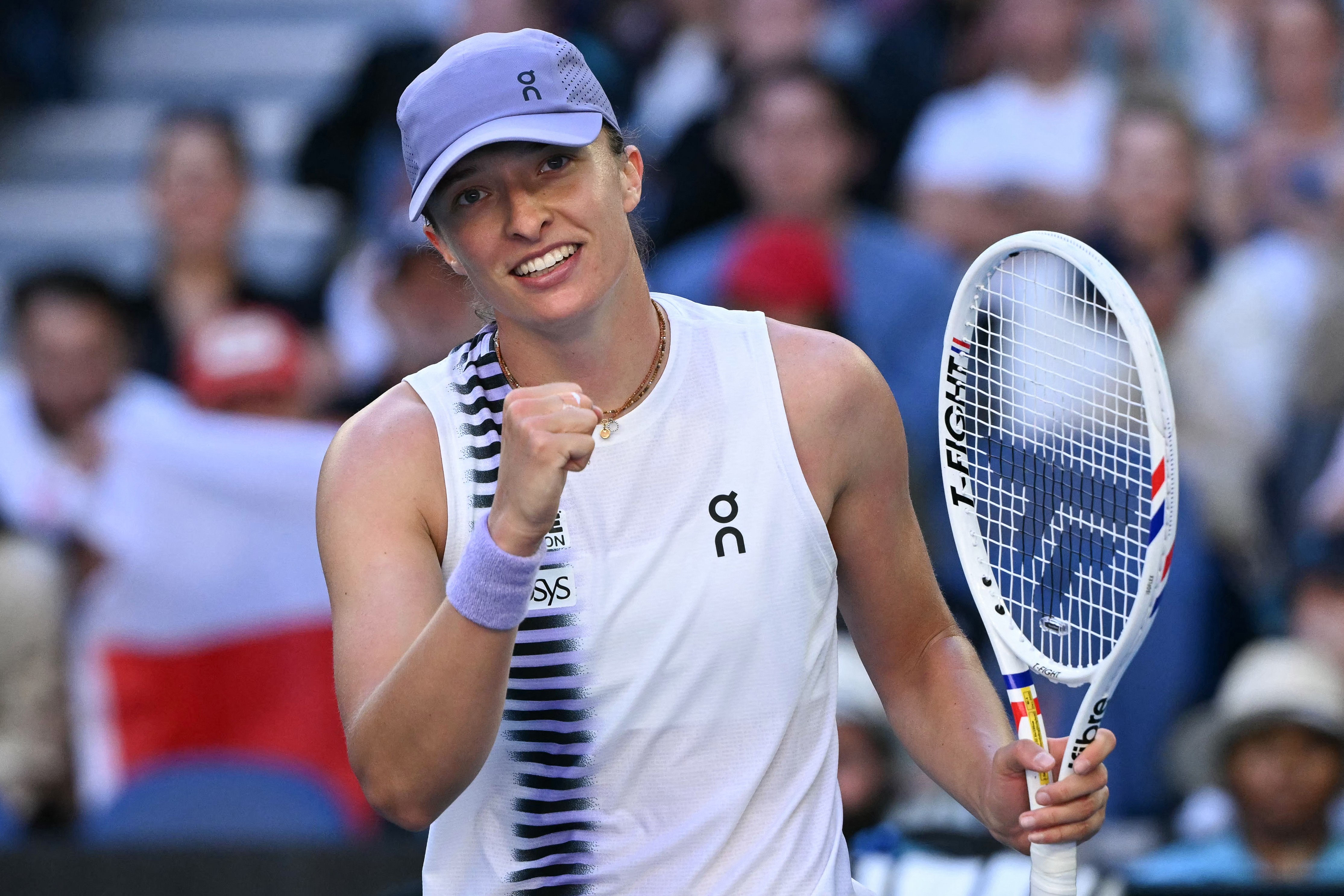 Iga Swiatek celebrates a match point against Marie Bouzkova