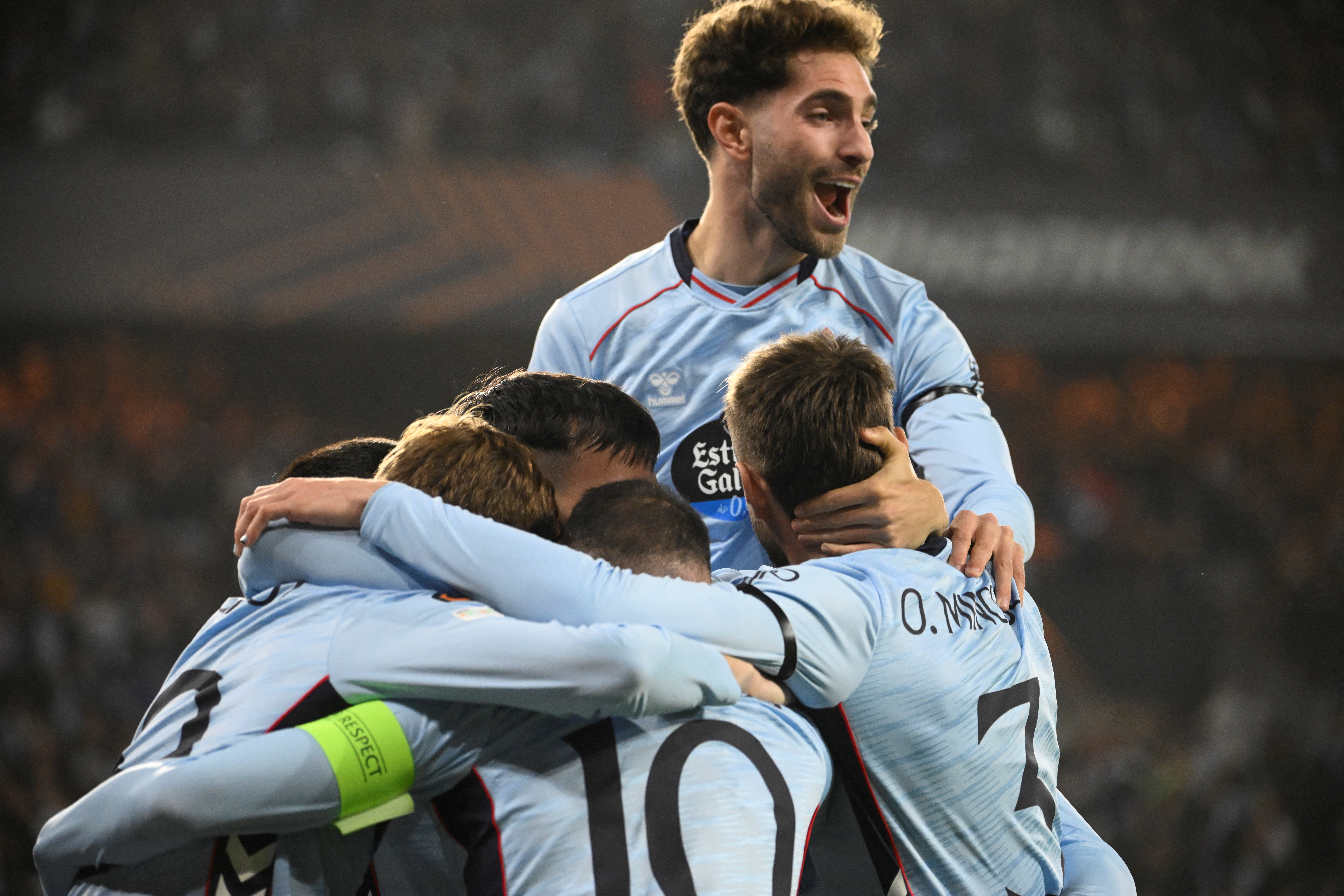 Celta Vigo's Williot Swedberg is mobbed by teammates after scoring his side's first goal against Lille