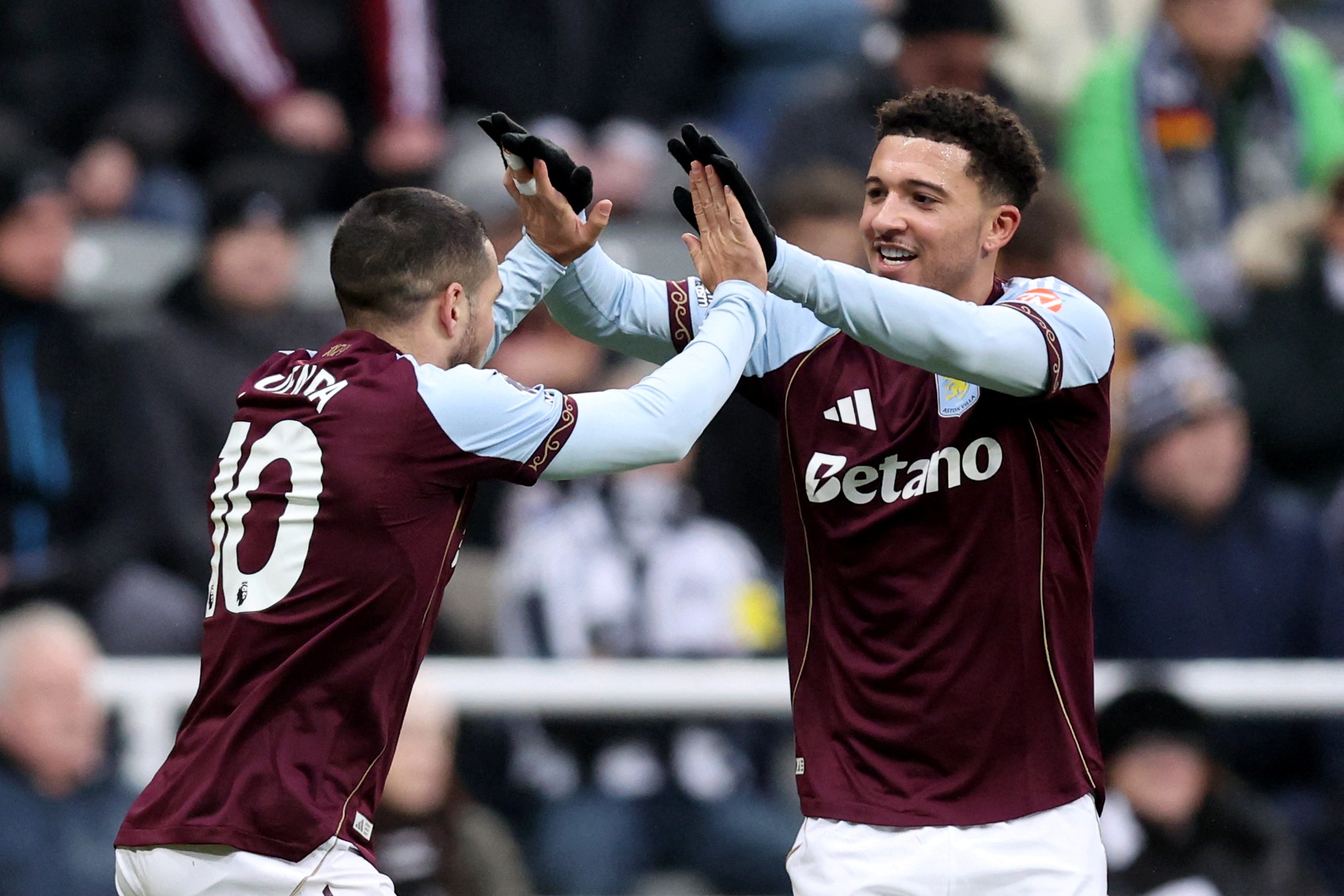 Emi Buendia celebrates scoring Aston Villa's opening goal with teammate Jadon Sancho