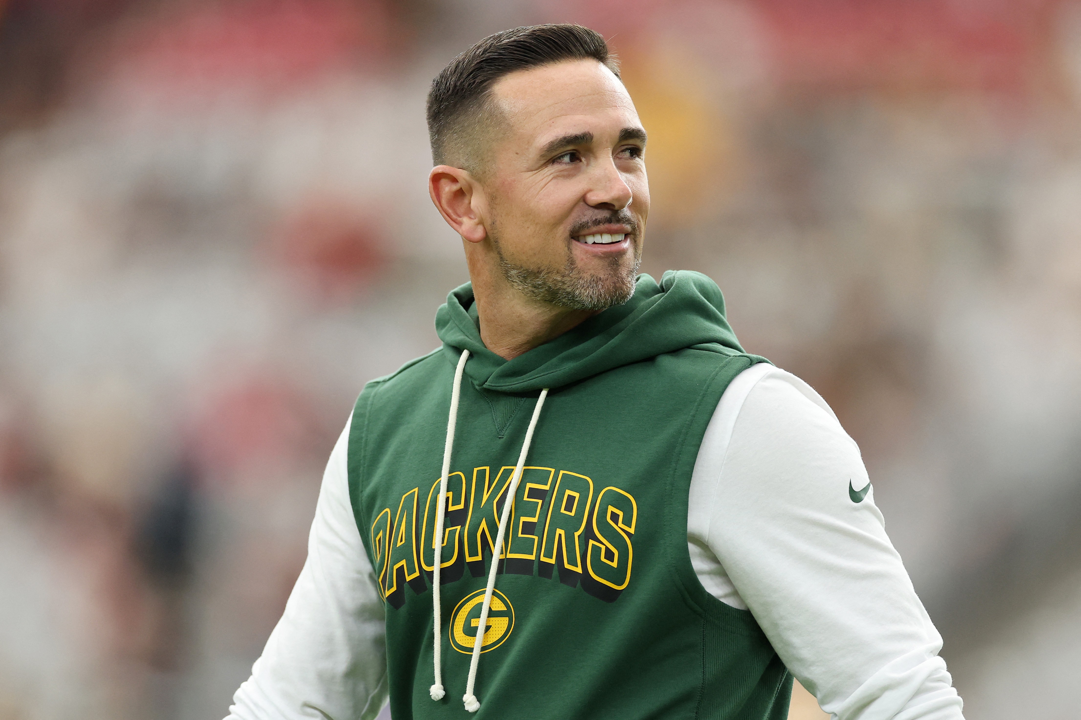Green Bay Packers head coach Matt LaFleur smiling before a game