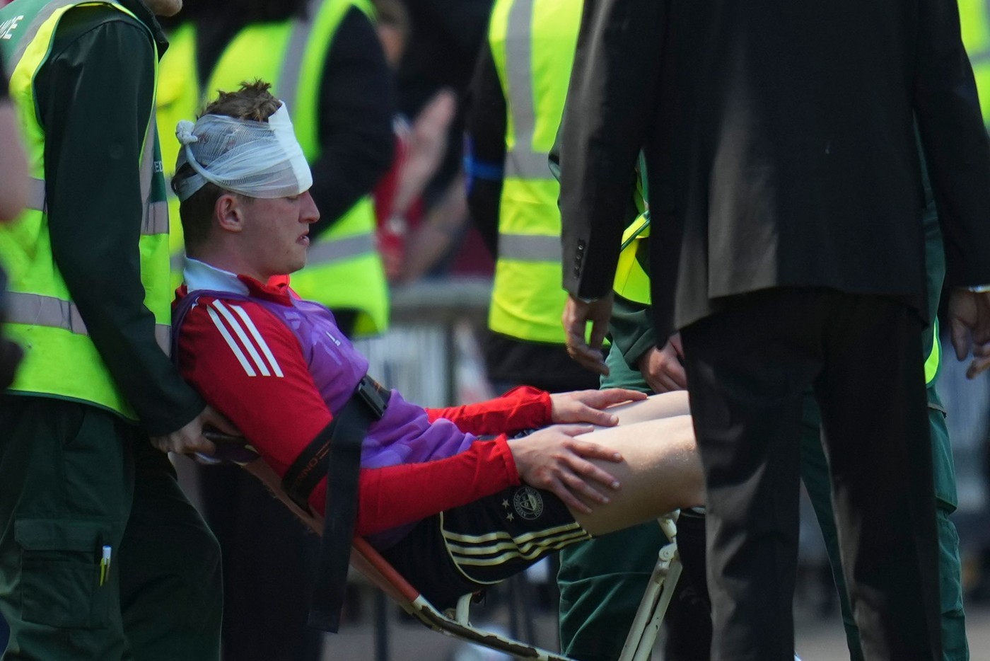 MacKenzie is treated after being hit by the chair