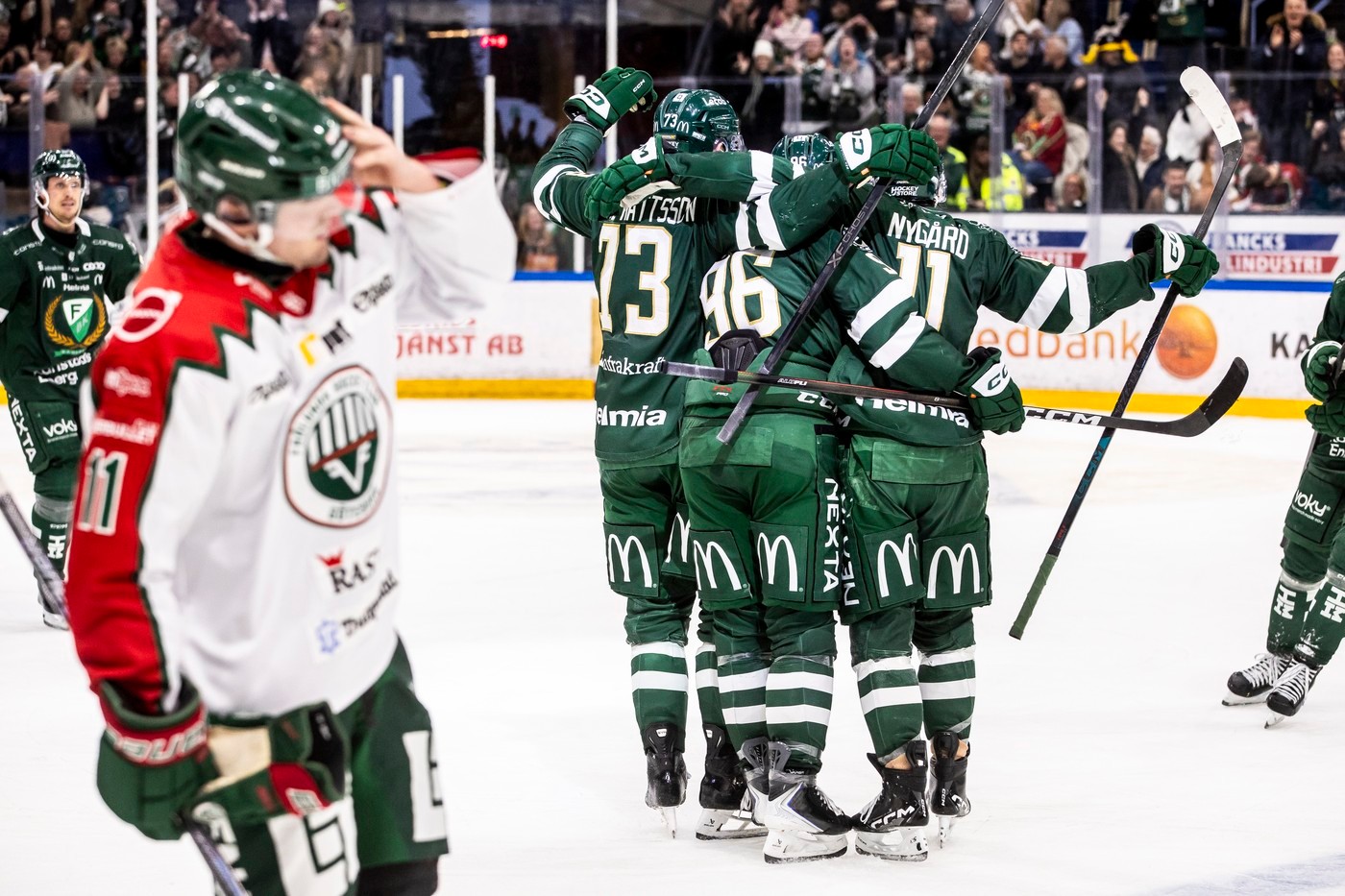 Farjestad players celebrate victory over Frolunda