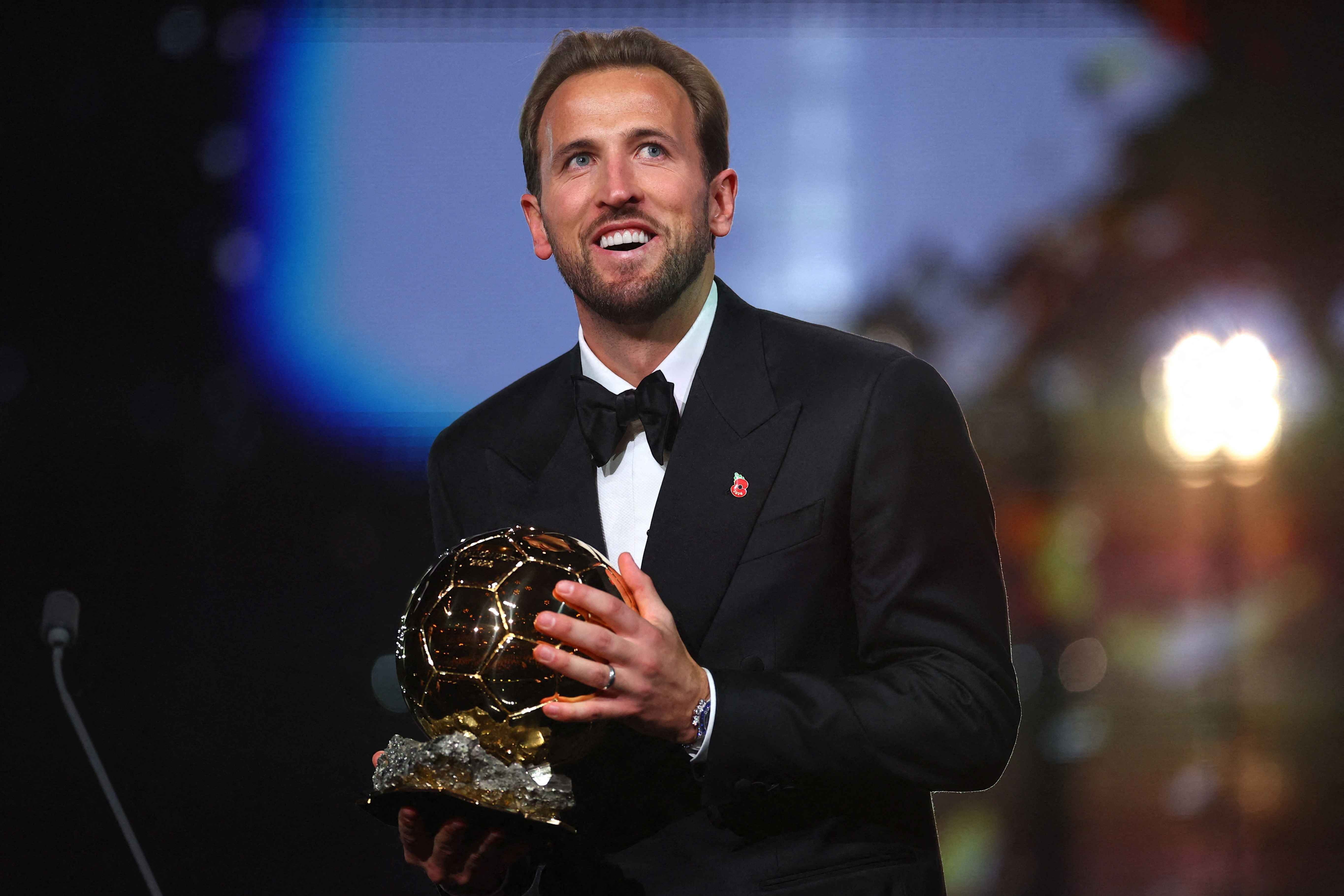 Harry Kane celebrates after winning the men's Ballon d'Or award