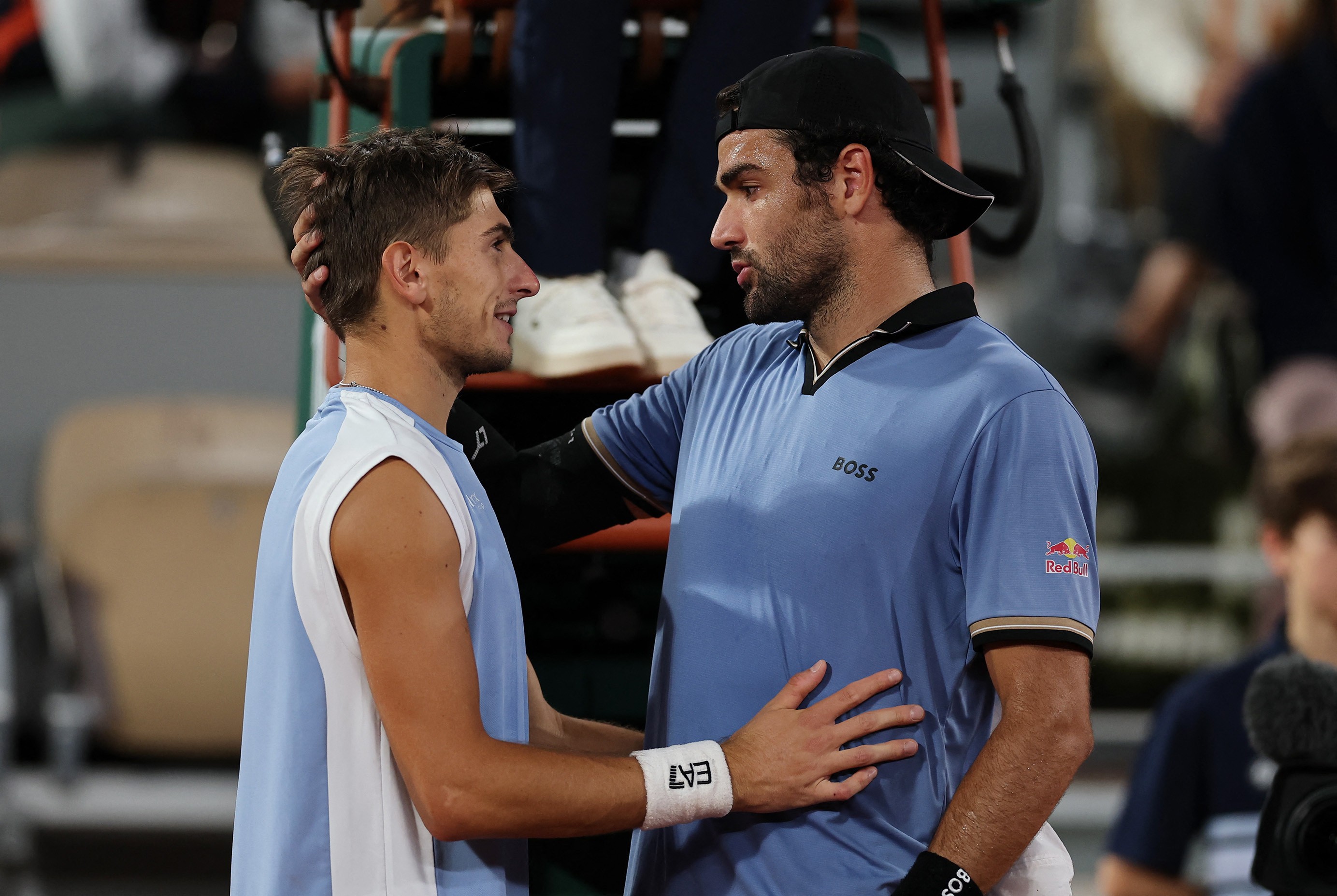 Matteo Arnaldi (L) and Berrettini after the match