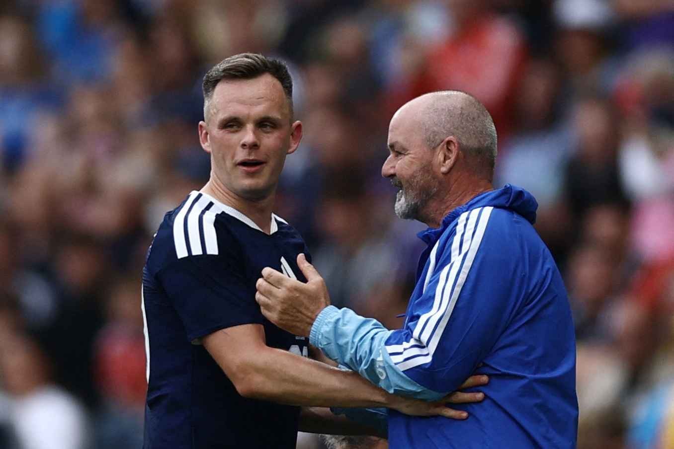 Scotland striker Lawrence Shankland (L) alongside manager Steve Clarke