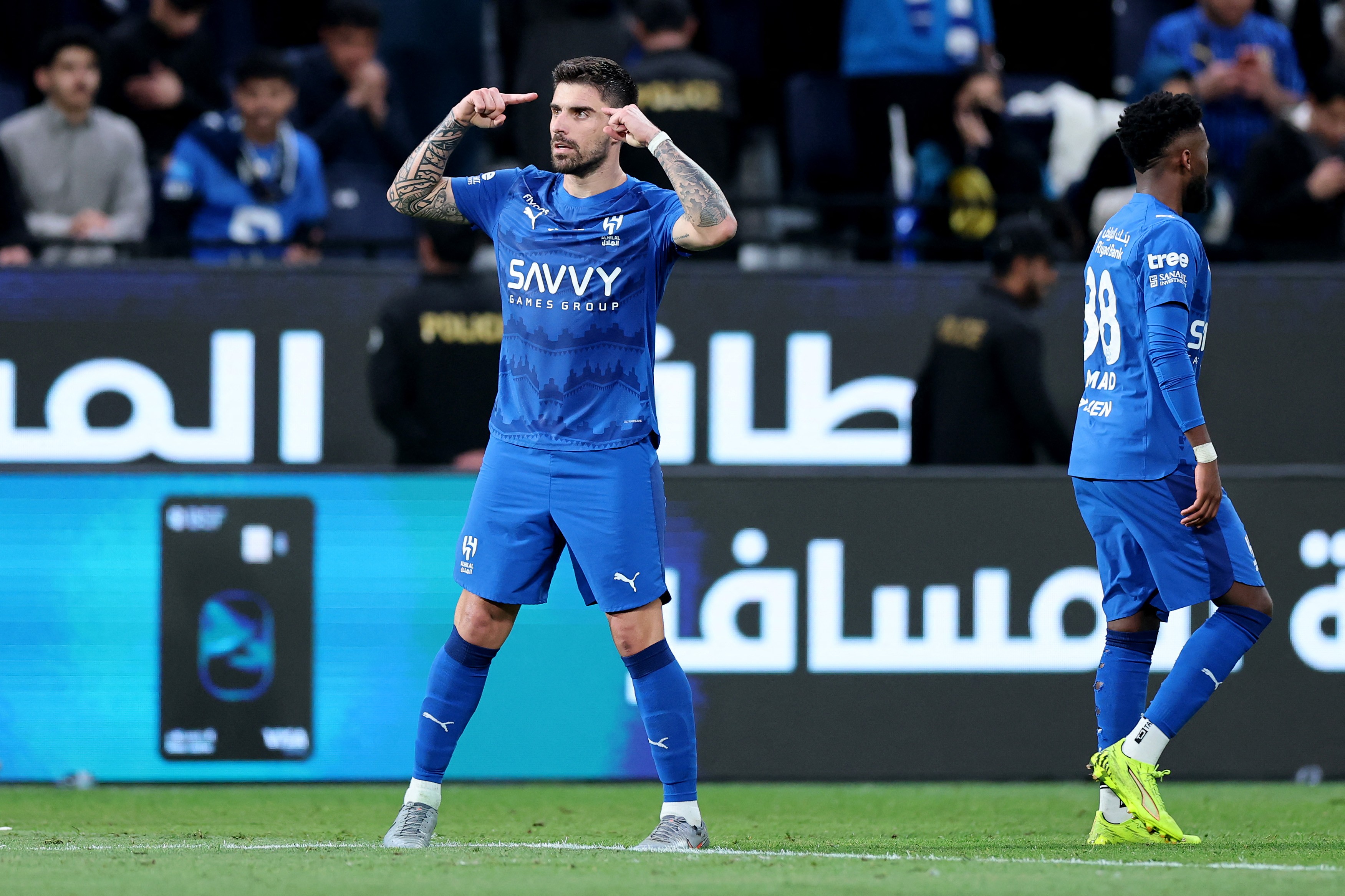 Neves (left) celebrates scoring for Al Hilal