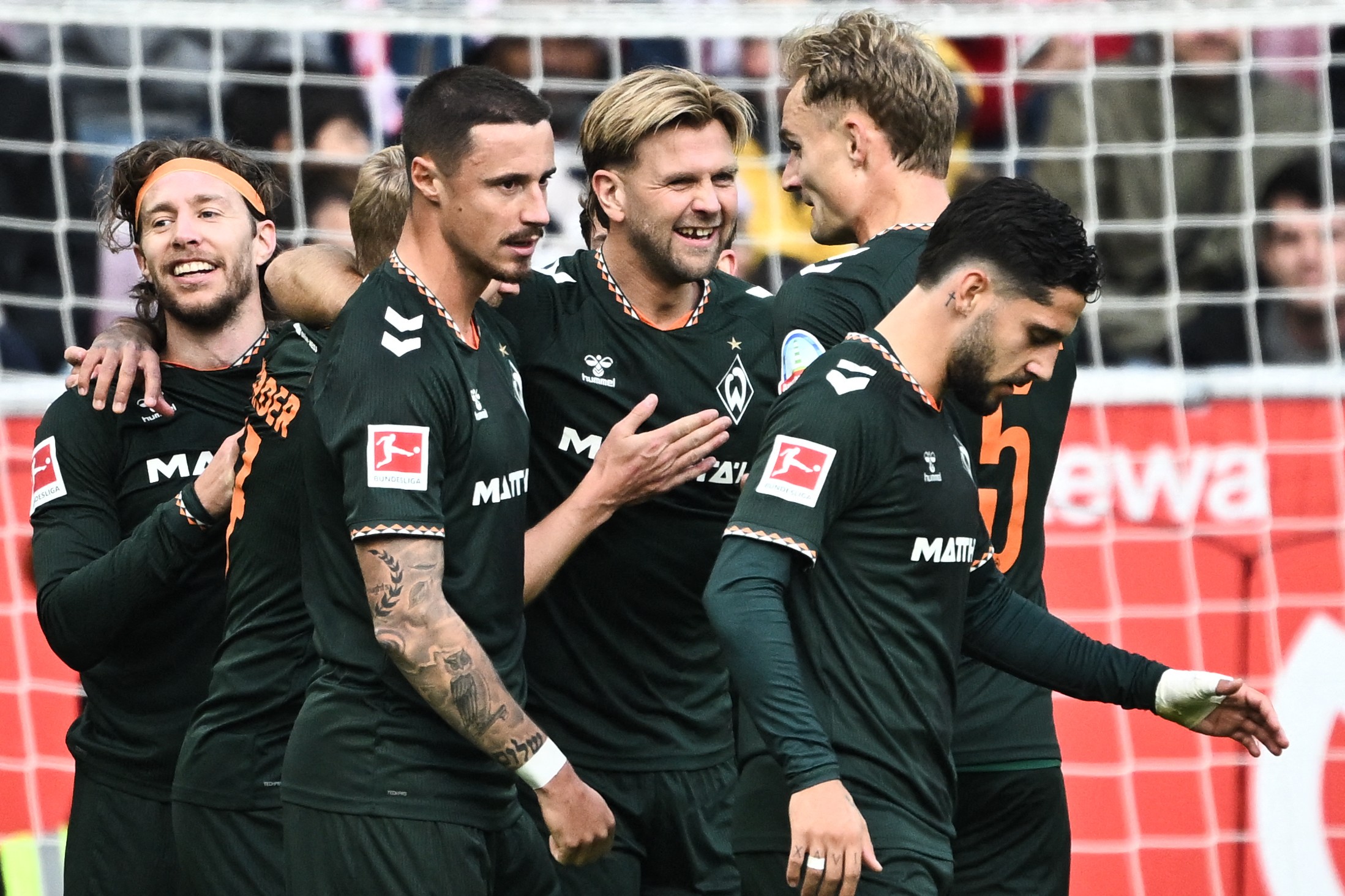 Niclas Fullkrug celebrates with teammates