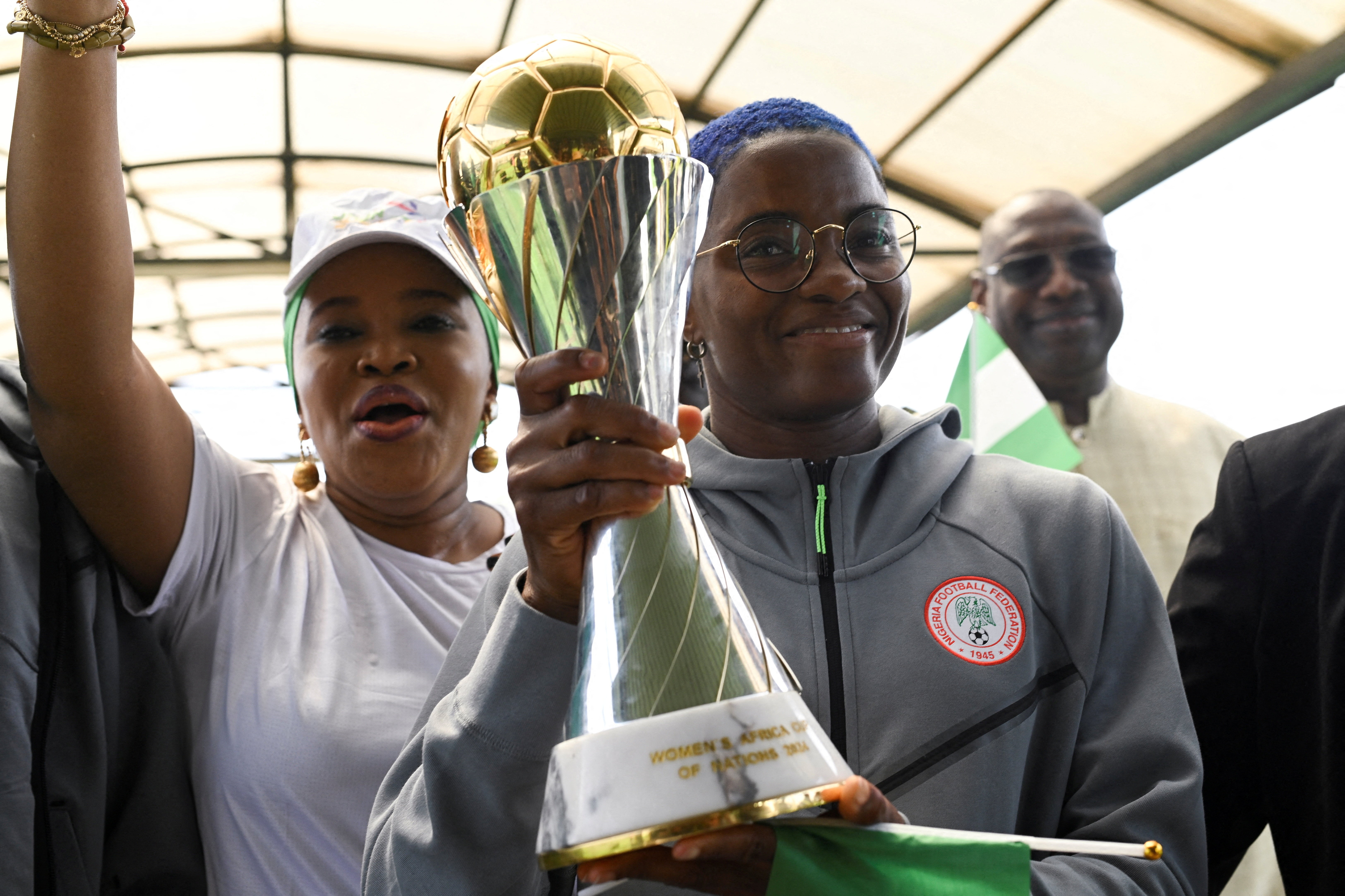 Nigeria’s Super Falcons captain Rasheedat Ajibade holds the Women’s Africa Cup of Nations trophy