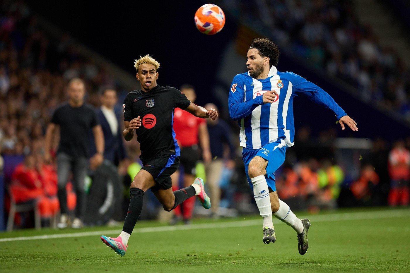 Barcelona's Lamine Yamal is challenged by Espanyol's Leandro Cabrera