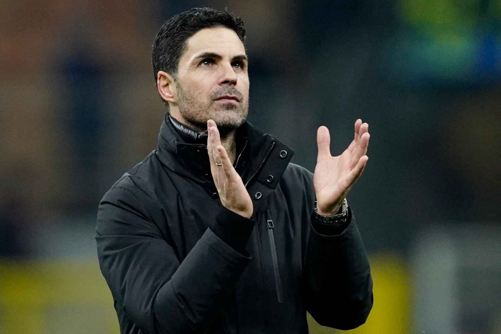 Arsenal manager Mikel Arteta applauds fans after the win over Inter 
