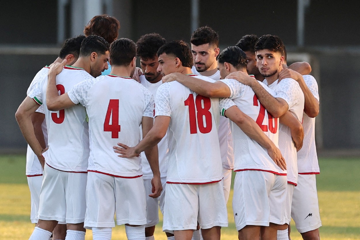 Iran players celebrate goal