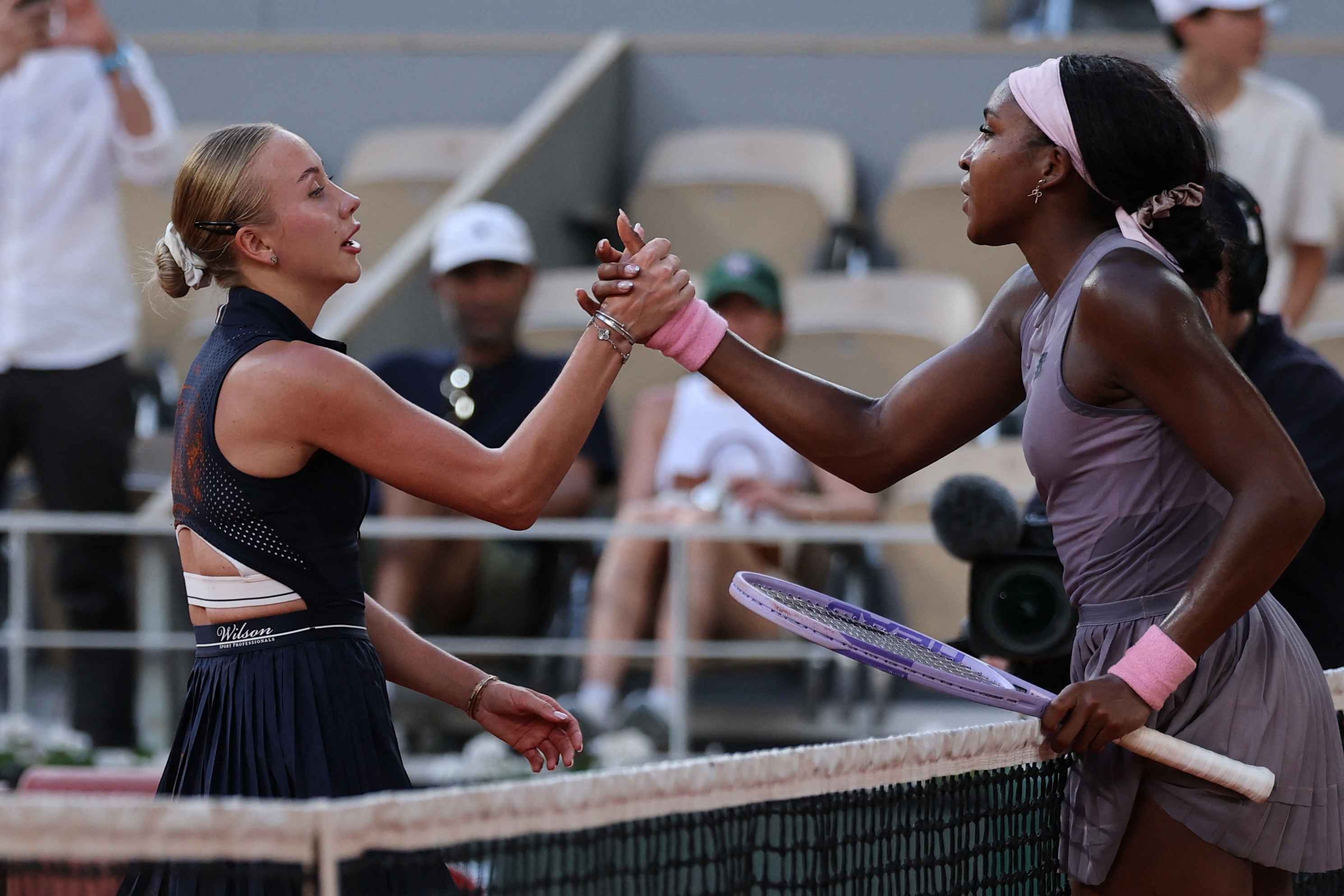 Anastasia Potapova shakes hands with Coco Gauff after shock win