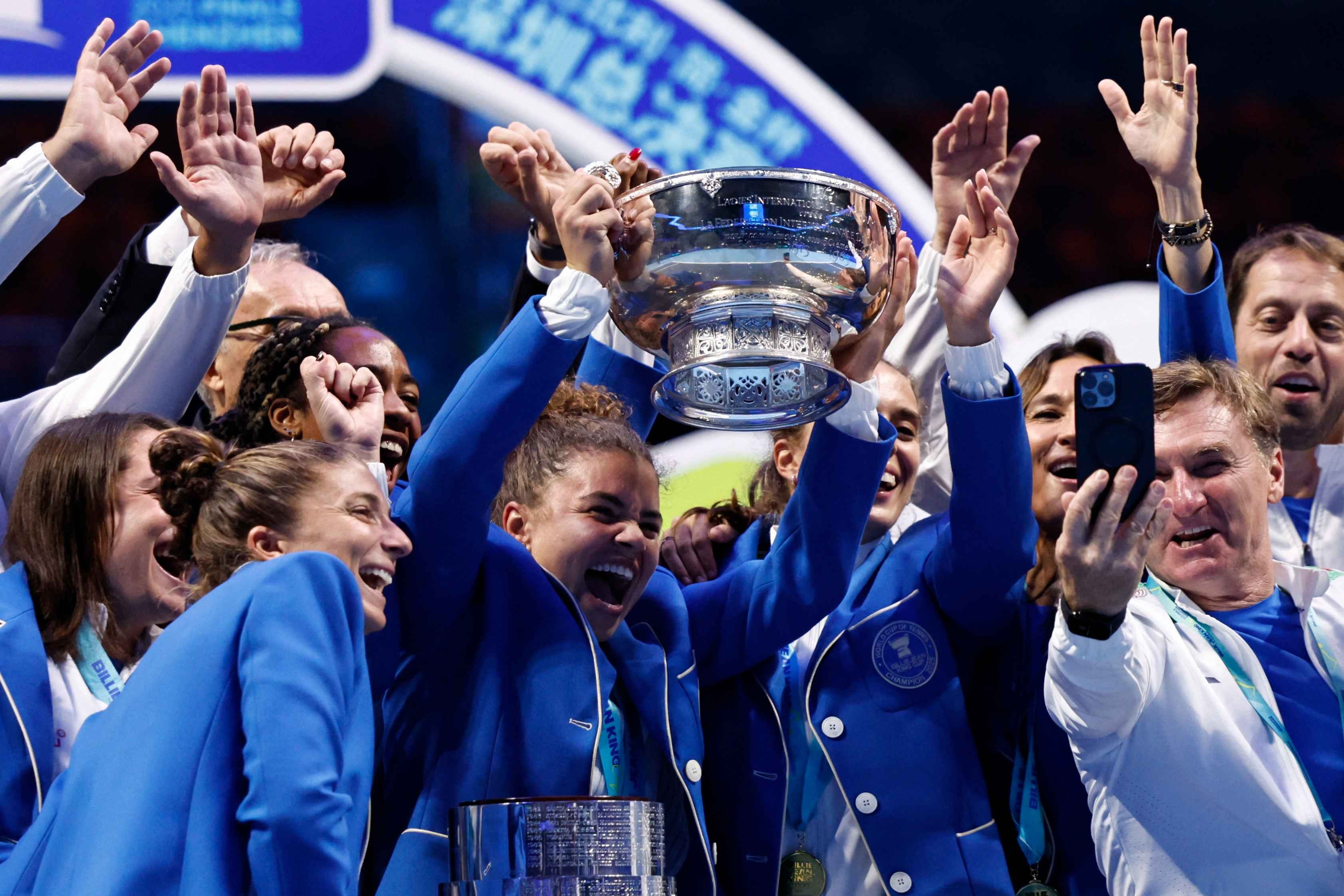 Italy's players celebrate with the trophy