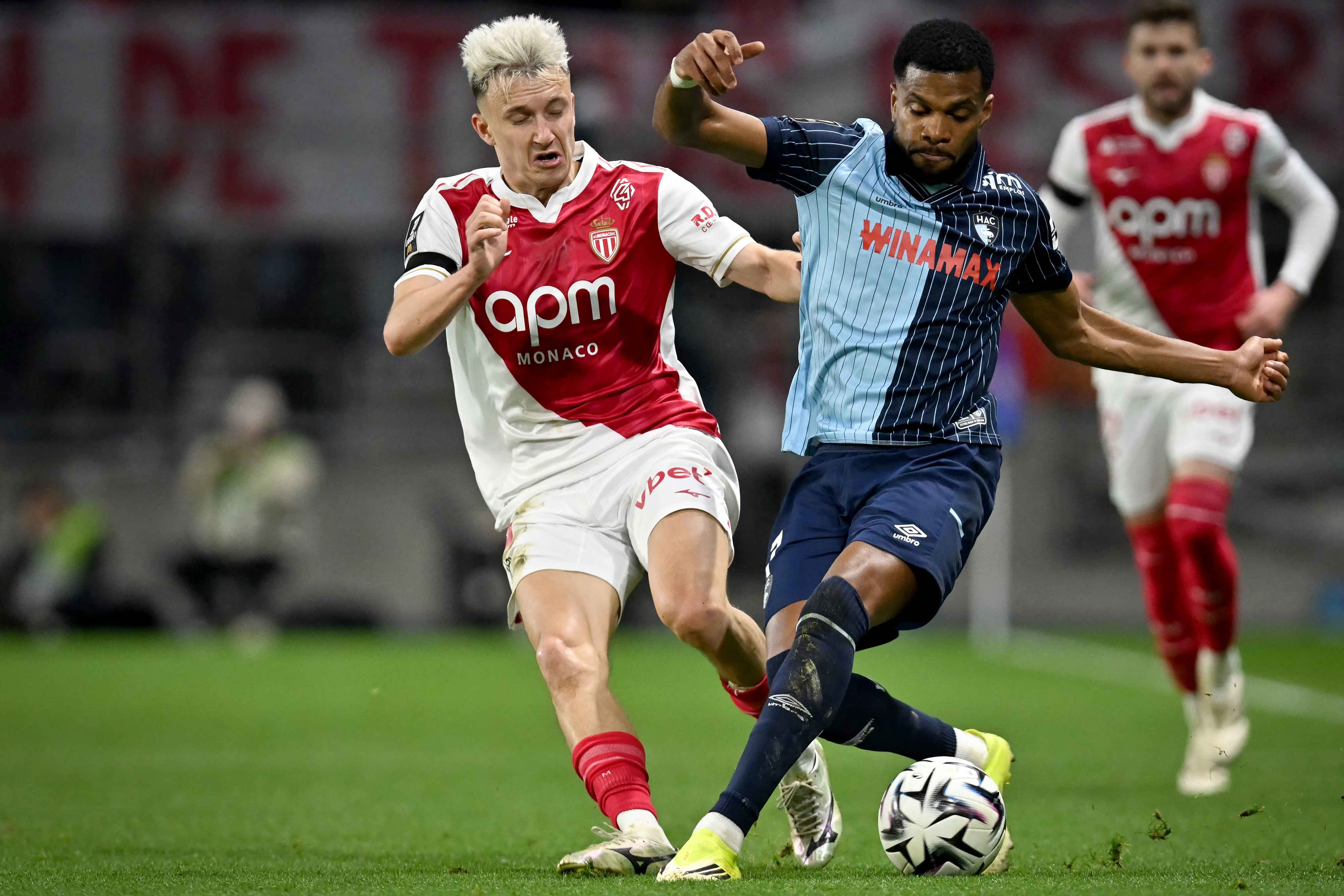 Aleksandr Golovin vies with Loic Nego for the ball