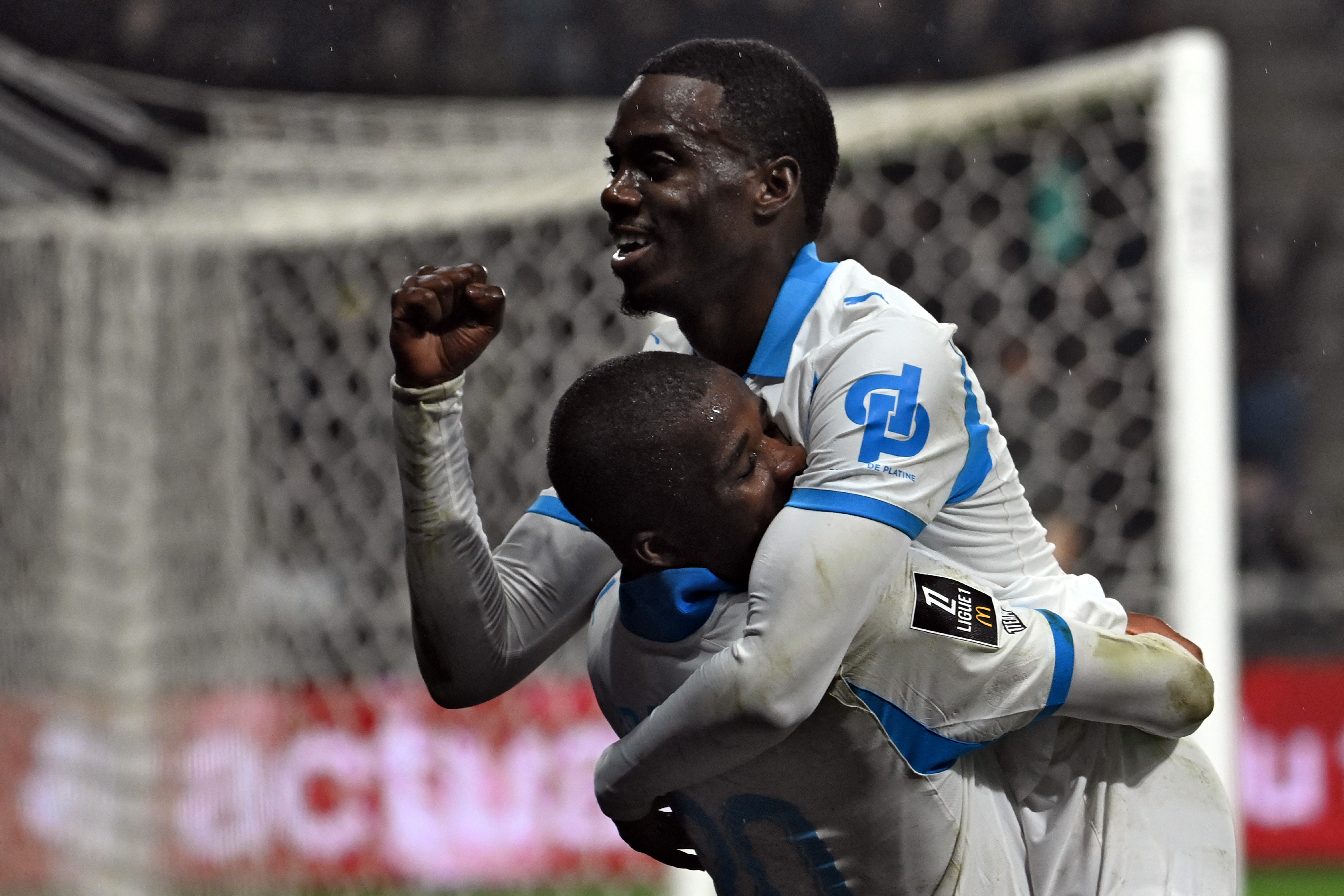 Marseille's Timothy Weah (right) celebrates after scoring against Angers