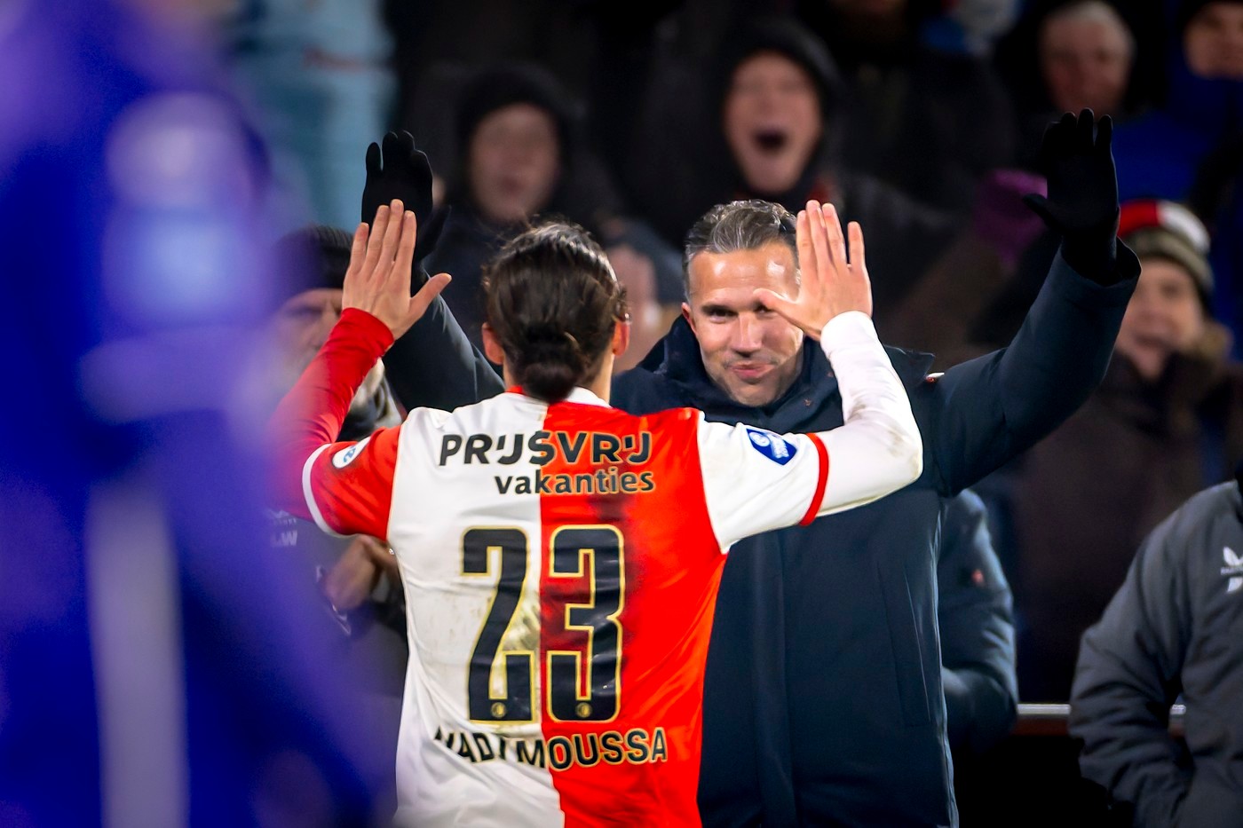 Feyenoord's Anis Hadj Moussa high-fives manager Robin van Persie after scoring the 3-1 against Heracles Almelo