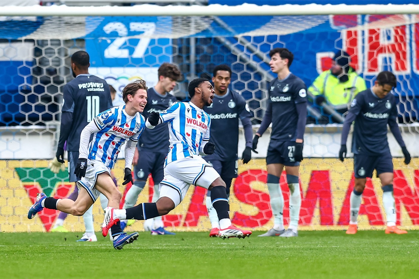 Heerenveen's Amourricho van Axel Dongen celebrates scoring the 2-2 against Feyenoord