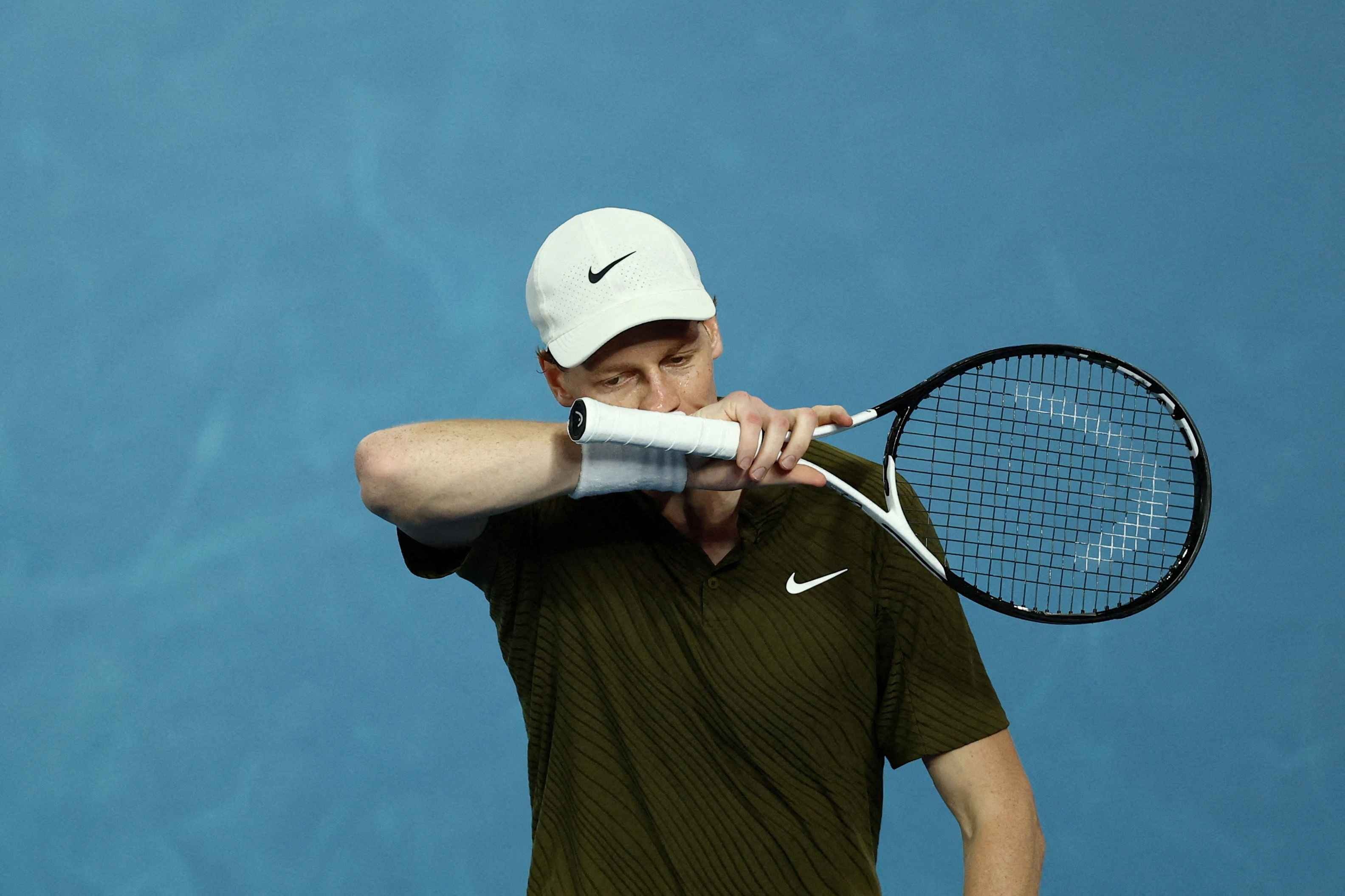 Jannik Sinner reacts during his semi-final against Novak Djokovic 
