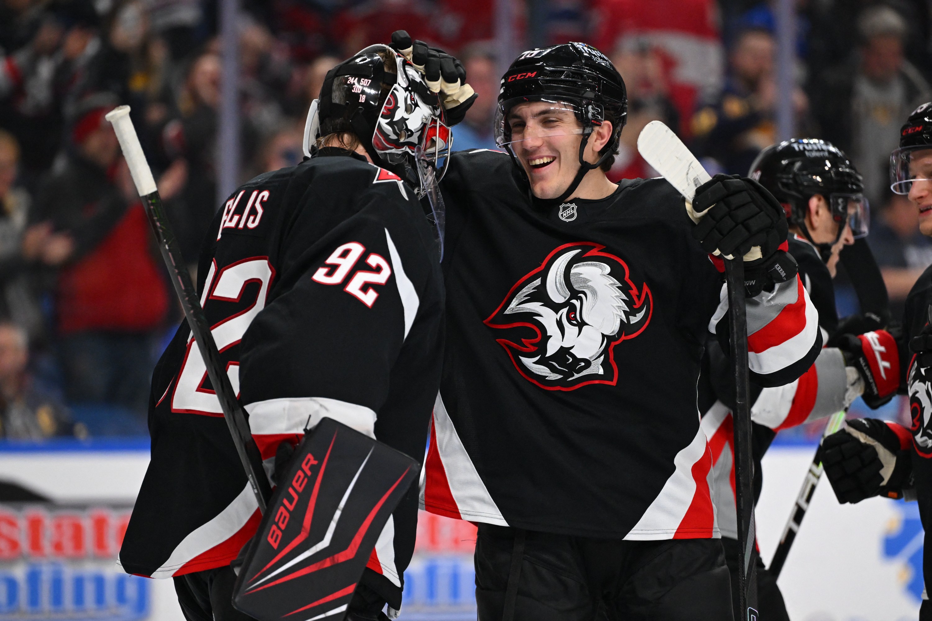 Colten Ellis (left) and Peyton Krebs (right) celebrate Sabres win over Canadiens