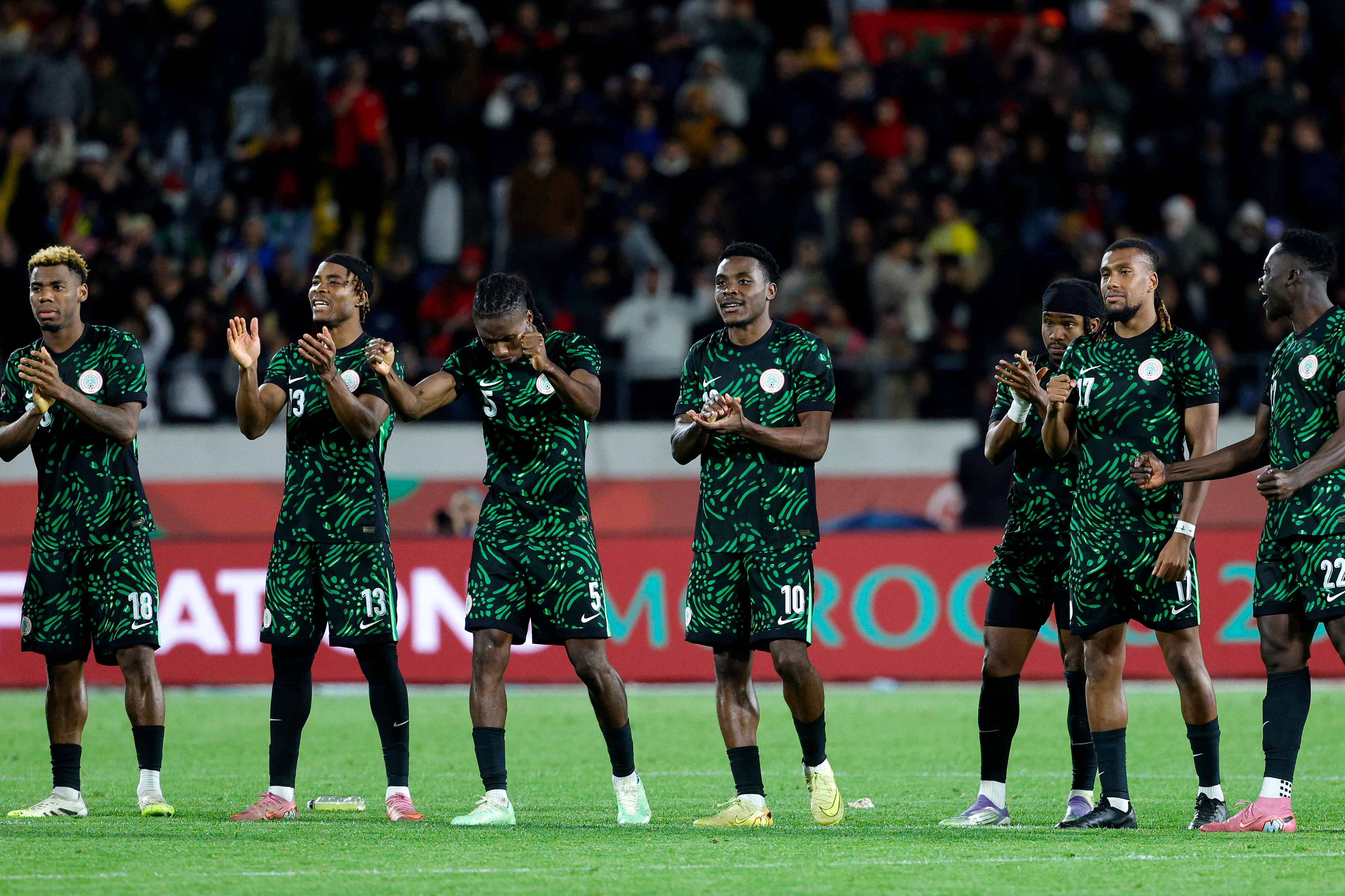 Nigeria's players watch on during the shootout