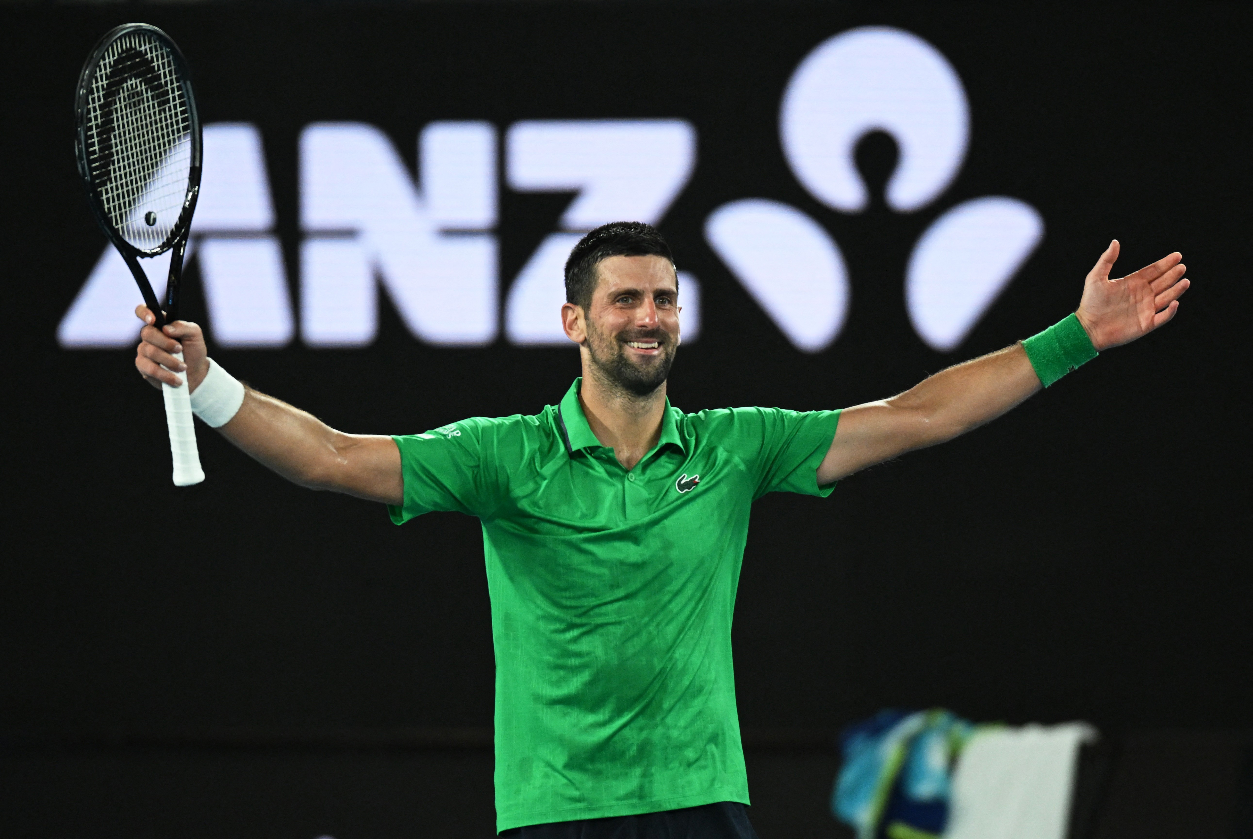 Novak Djokovic celebrates winning his semi-final match against Jannik Sinner 